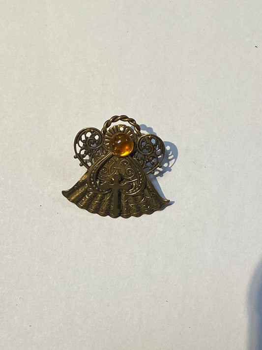 Small religious pin brooch