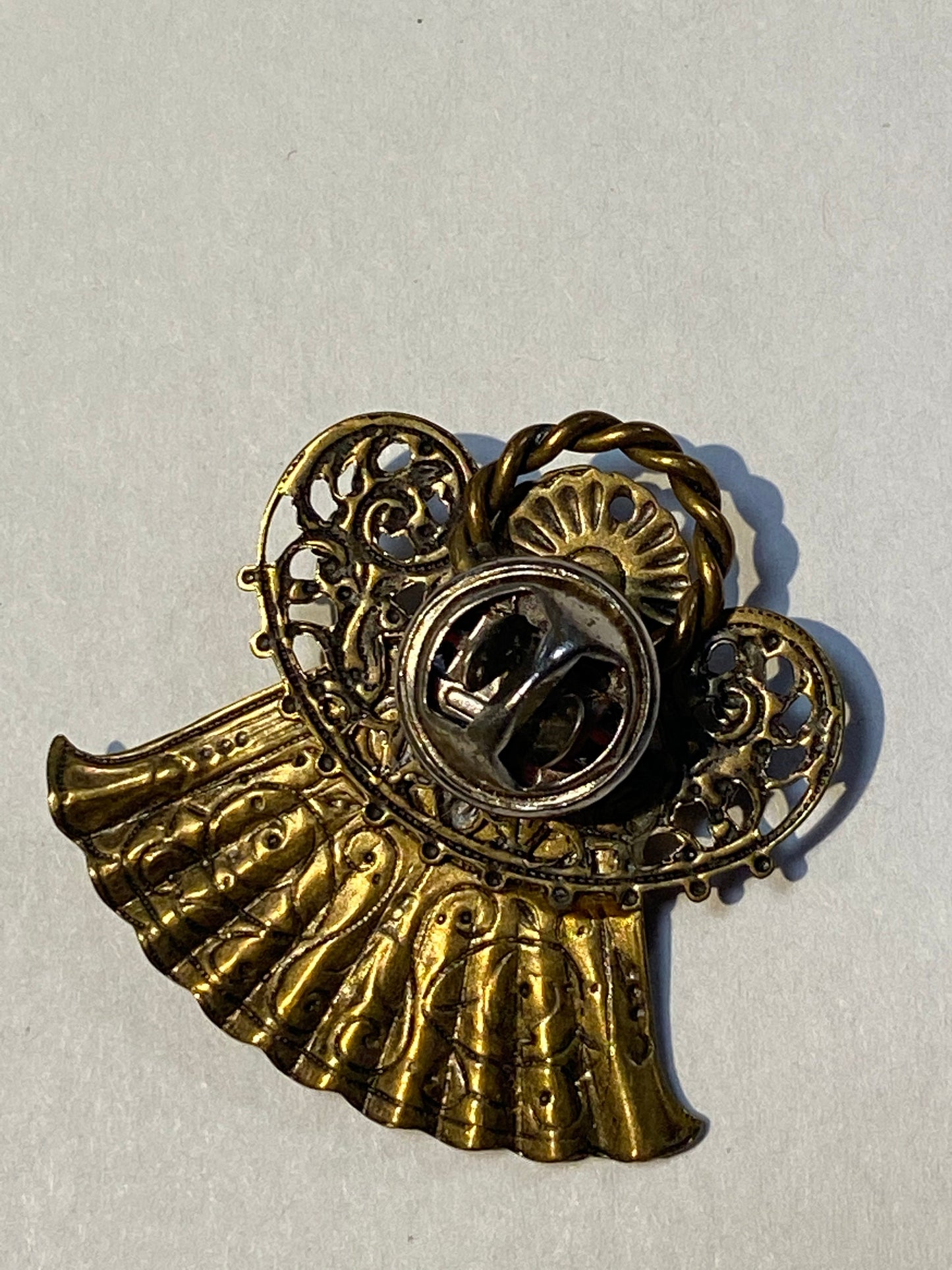 Small religious pin brooch