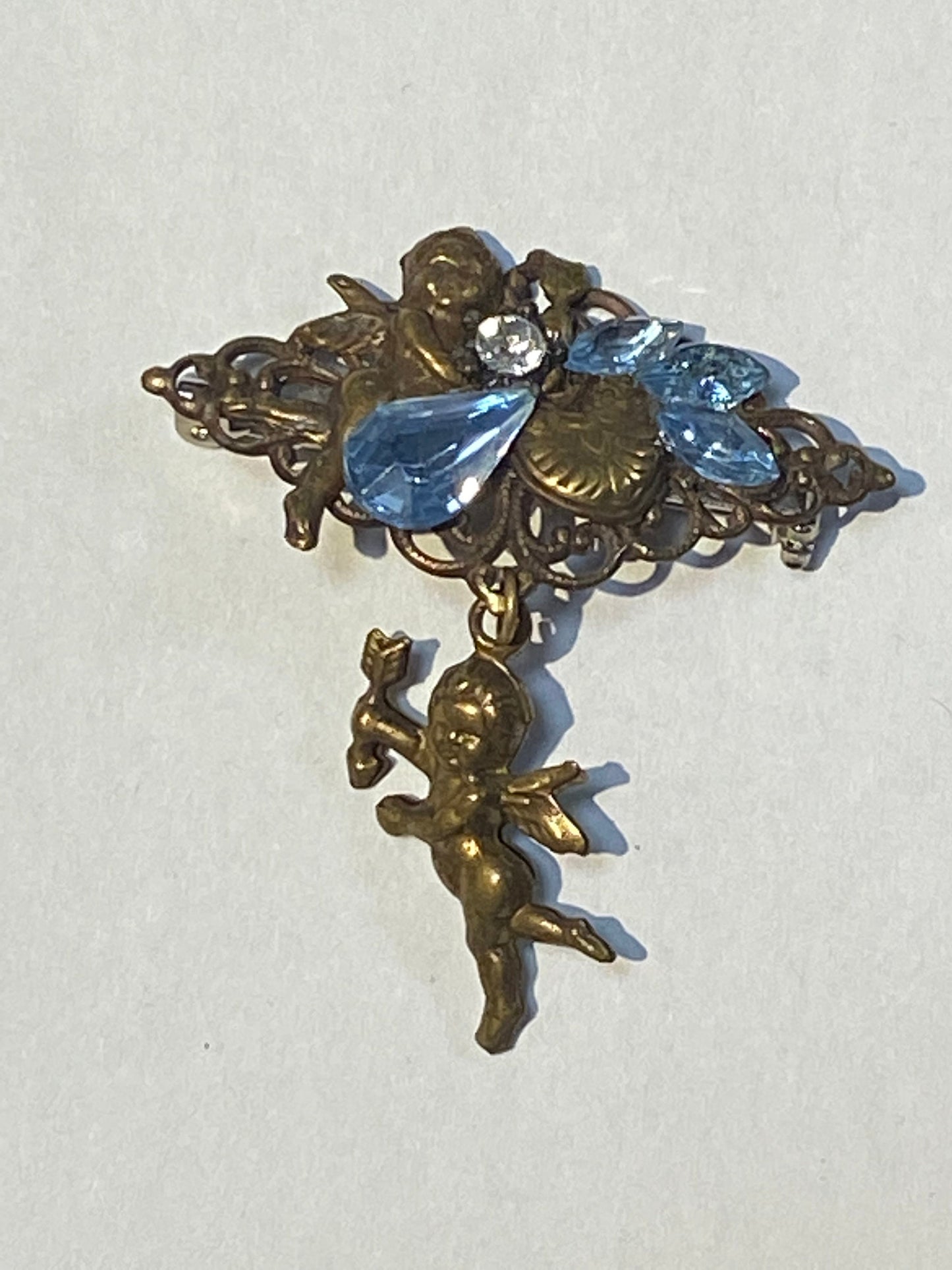 Beautiful brass Cupid brooch