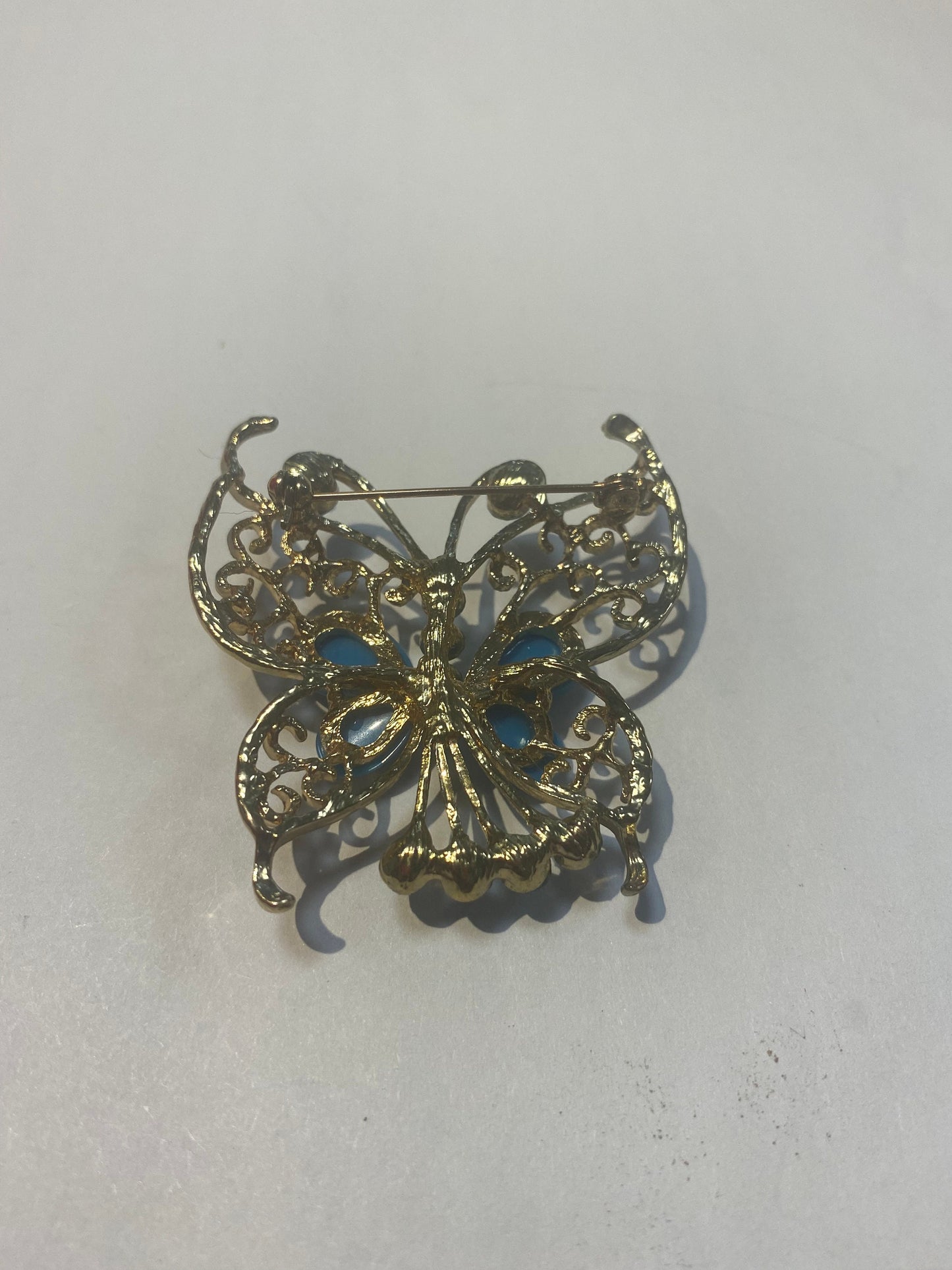 Turquoise and rhinestone butterfly brooch