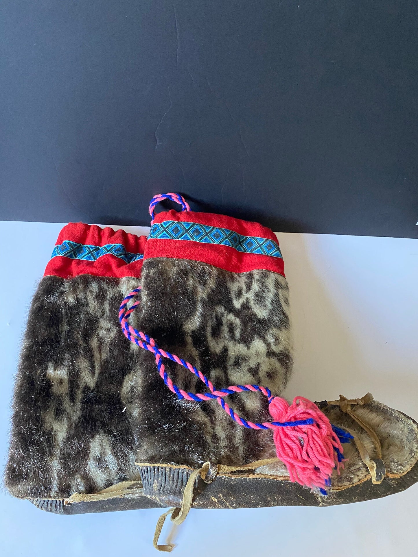 A  Magnificent pair of antique First Nations Canadian Inuit seal skin and embroidered moccasins  Boot 12 inches long and 16 inches tall