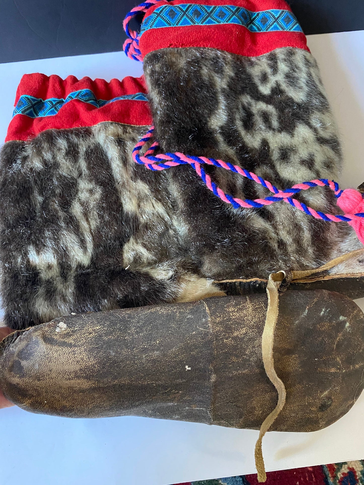 A  Magnificent pair of antique First Nations Canadian Inuit seal skin and embroidered moccasins  Boot 12 inches long and 16 inches tall