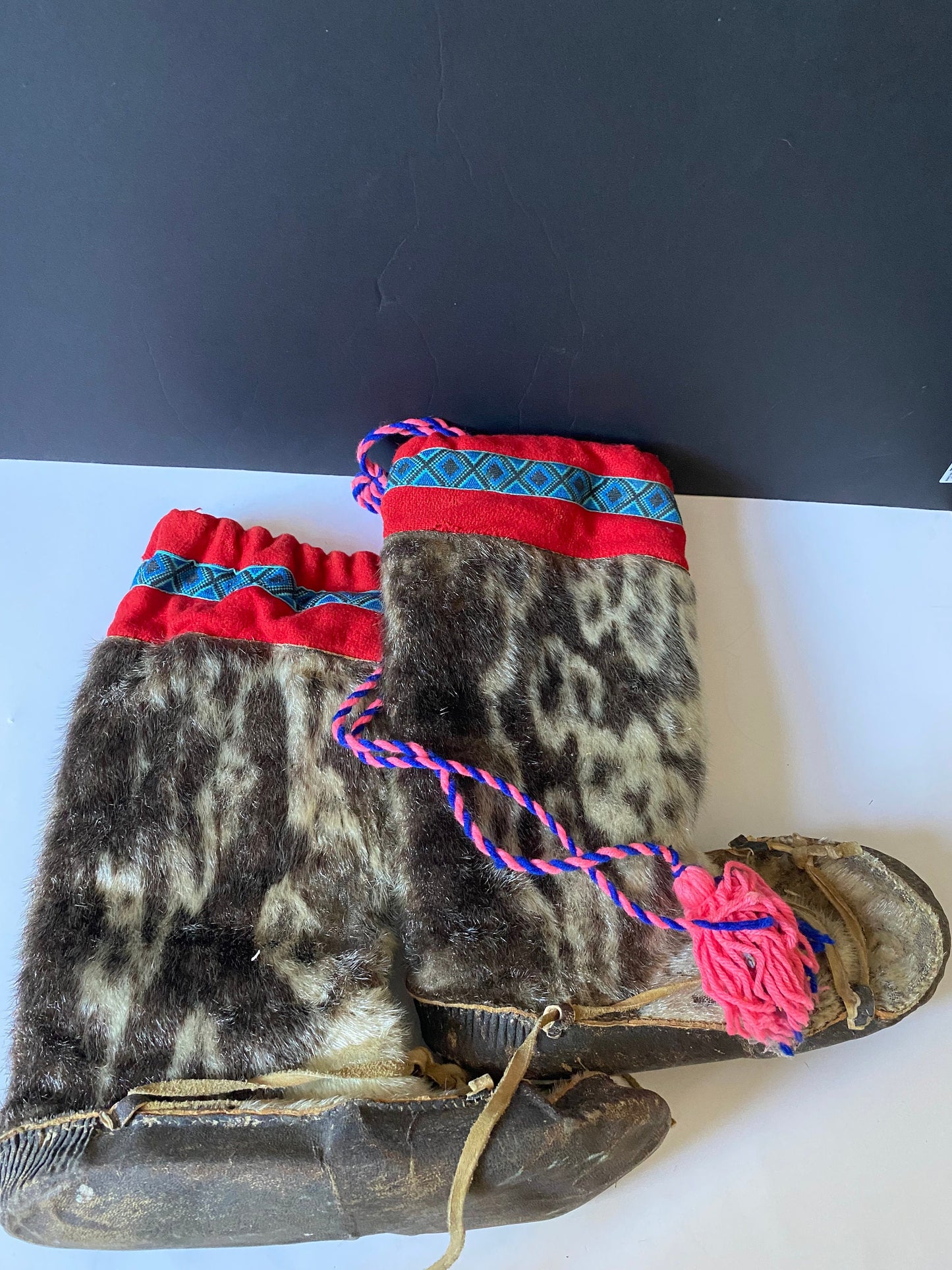 A  Magnificent pair of antique First Nations Canadian Inuit seal skin and embroidered moccasins  Boot 12 inches long and 16 inches tall