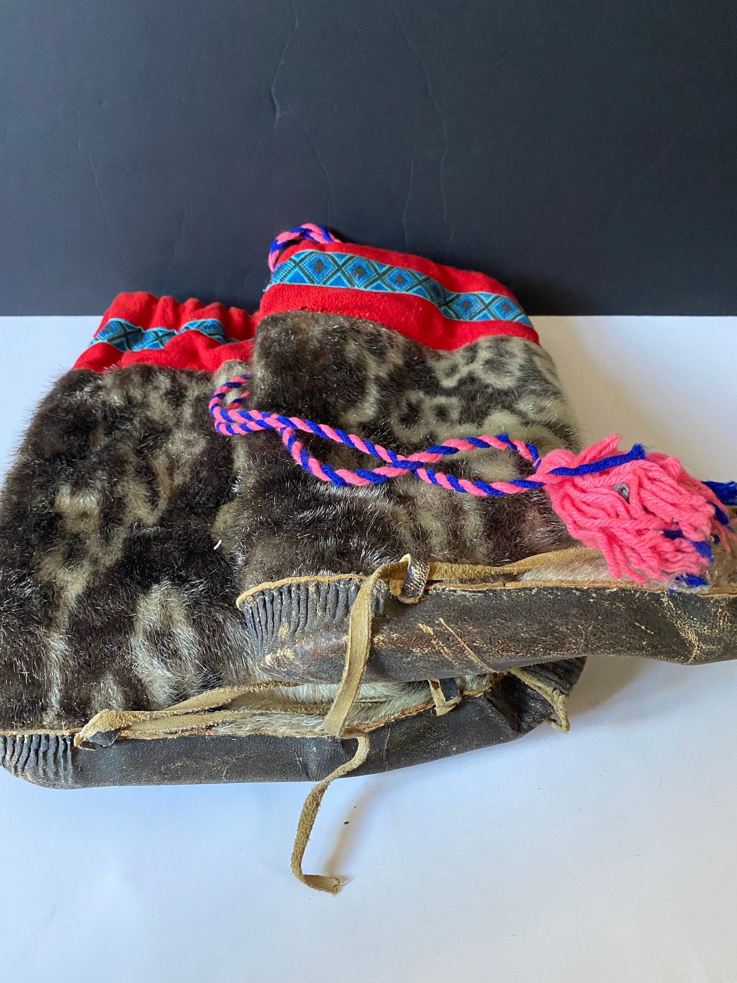 A  Magnificent pair of antique First Nations Canadian Inuit seal skin and embroidered moccasins  Boot 12 inches long and 16 inches tall