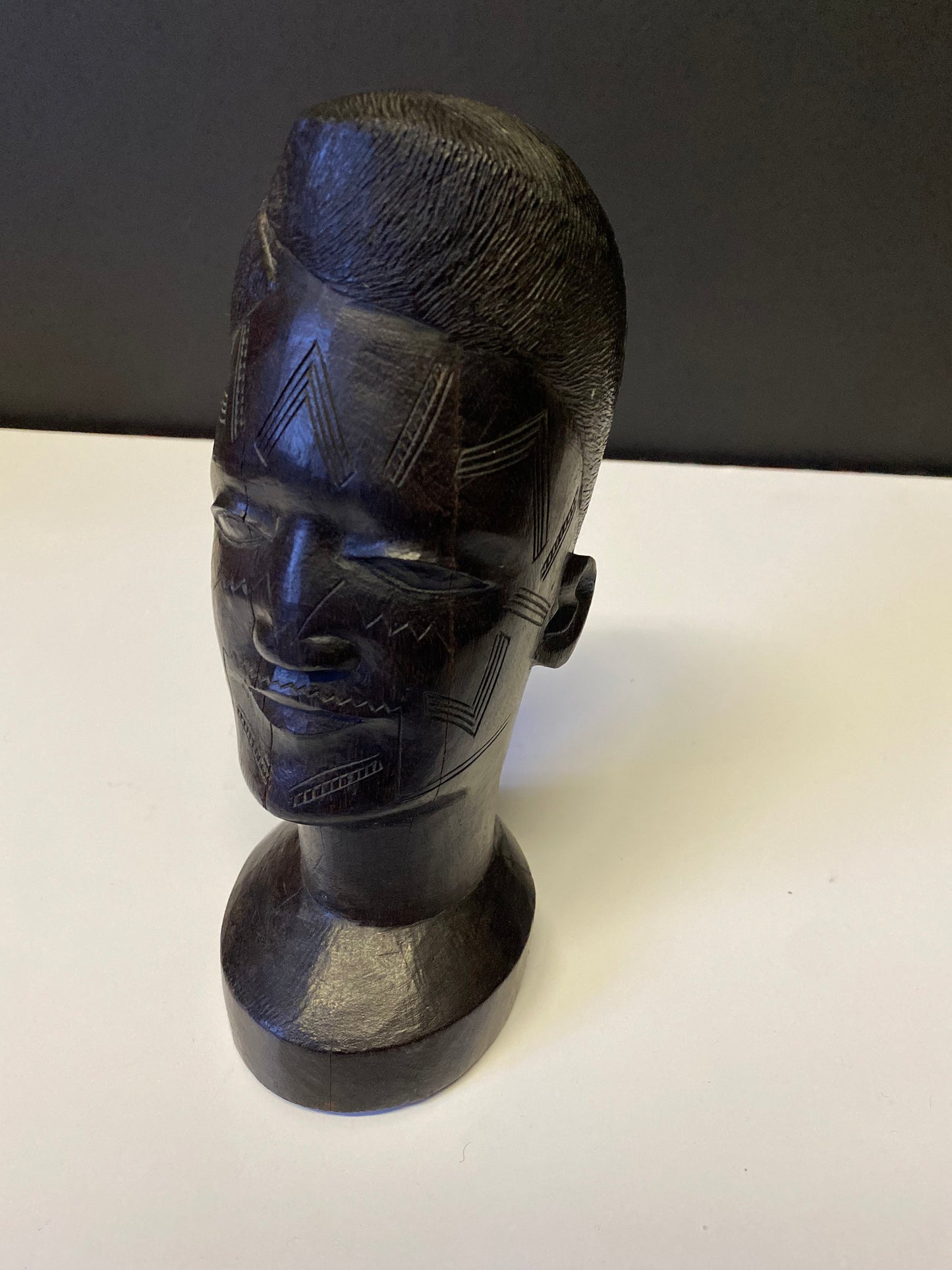 A Fabulous western 8 inch African Carved Ebony bust of a male warrior  great detail  wow  face detail is amazing