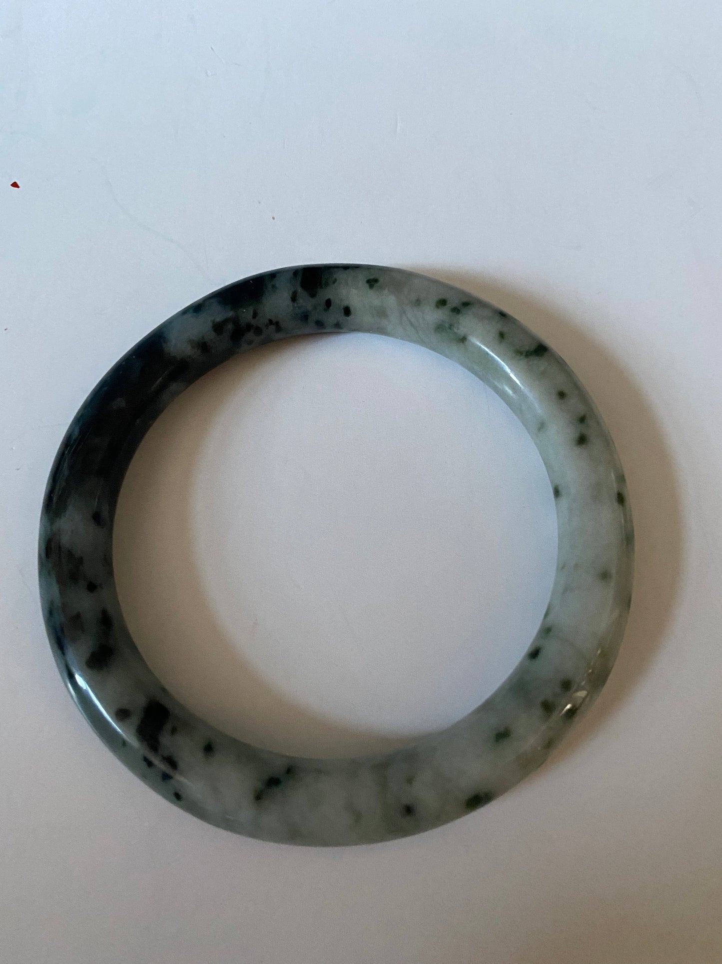 An  Absolutely fabulous Chinese rare Jade bangle  Mixture of green and black jades  3 inches with 2 inches inside  Museum quality  wow