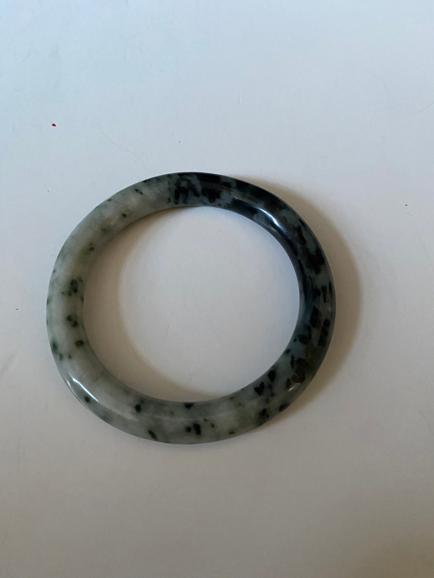 An  Absolutely fabulous Chinese rare Jade bangle  Mixture of green and black jades  3 inches with 2 inches inside  Museum quality  wow