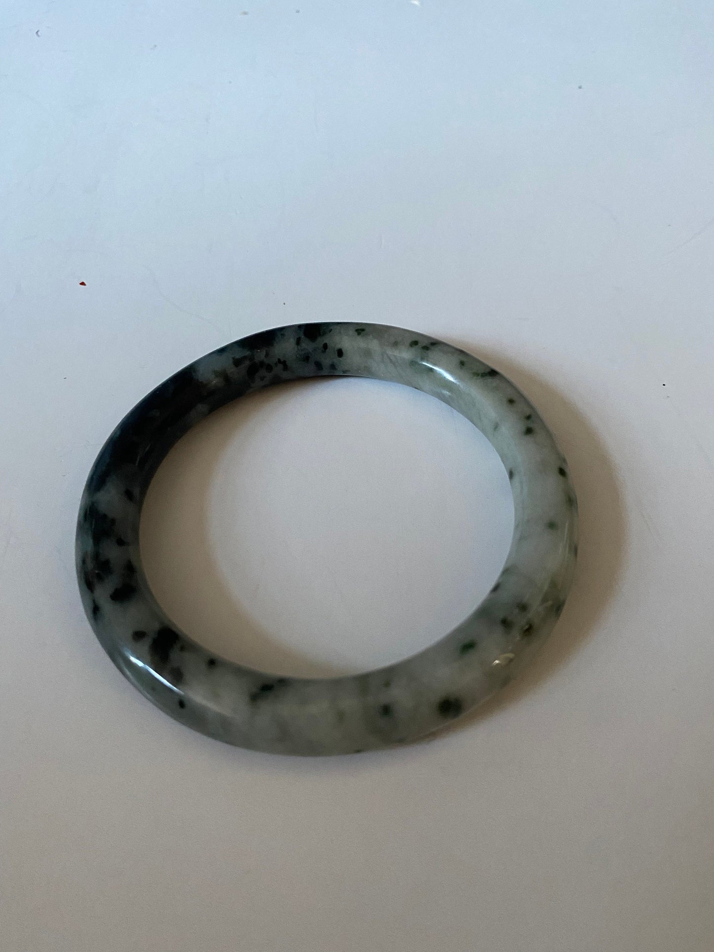 An  Absolutely fabulous Chinese rare Jade bangle  Mixture of green and black jades  3 inches with 2 inches inside  Museum quality  wow