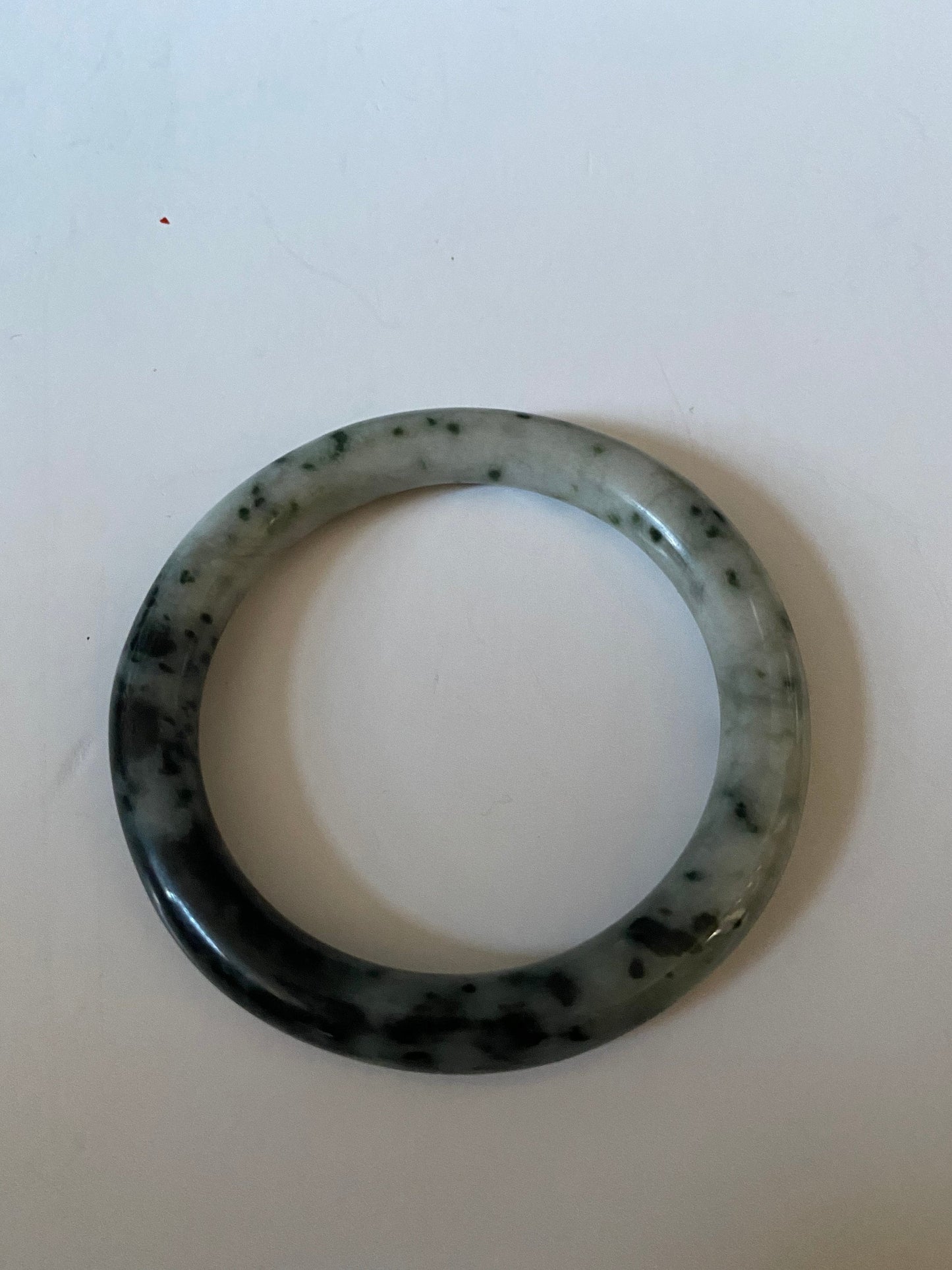 An  Absolutely fabulous Chinese rare Jade bangle  Mixture of green and black jades  3 inches with 2 inches inside  Museum quality  wow