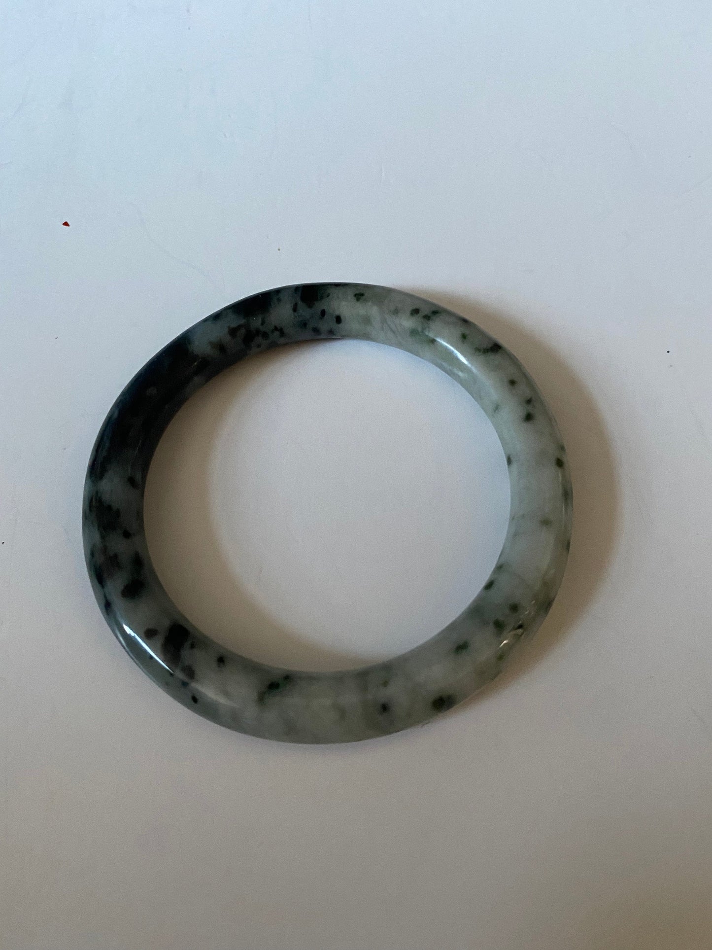 An  Absolutely fabulous Chinese rare Jade bangle  Mixture of green and black jades  3 inches with 2 inches inside  Museum quality  wow