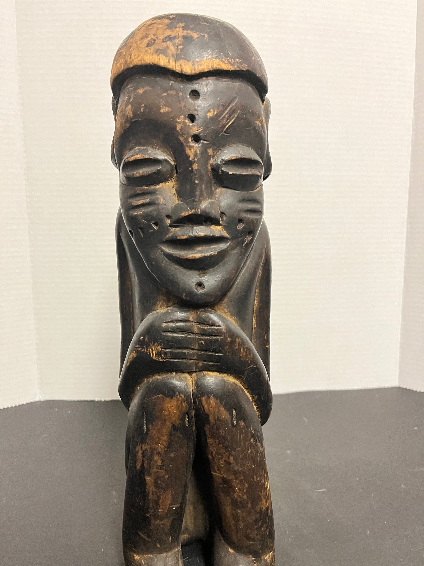 Museum quality 14 inch tall western African seated  statue of a man  Great Patina and wonderful detail  Historical beauty