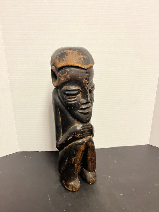 Museum quality 14 inch tall western African seated  statue of a man  Great Patina and wonderful detail  Historical beauty