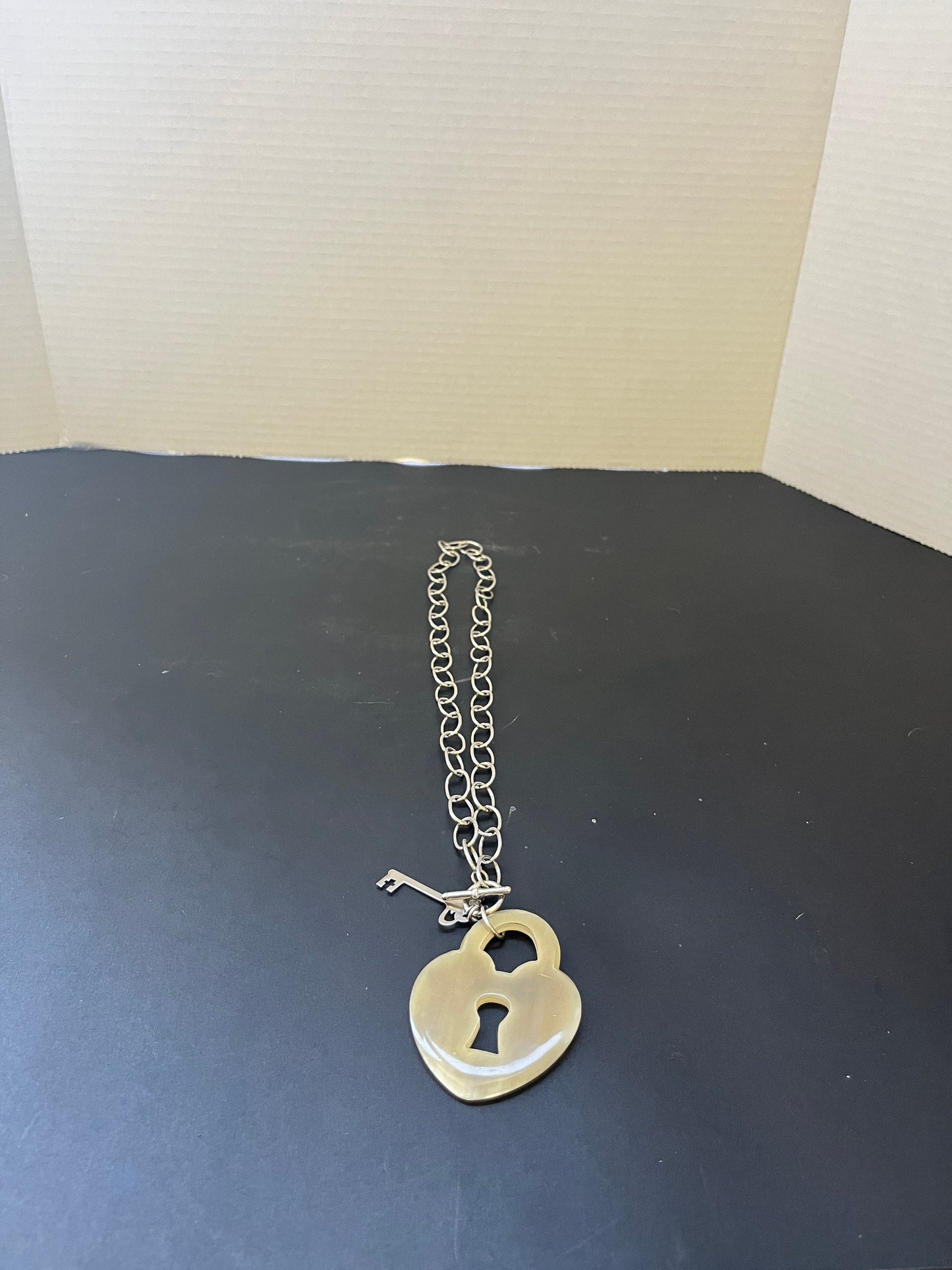 Stamped 925 silver and Horn 25 inch approximate necklace with heart and key