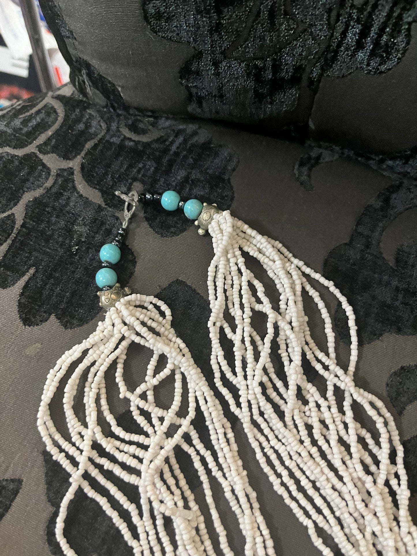 Beautiful, approximately 30 inch long, white coral necklace with turquoise