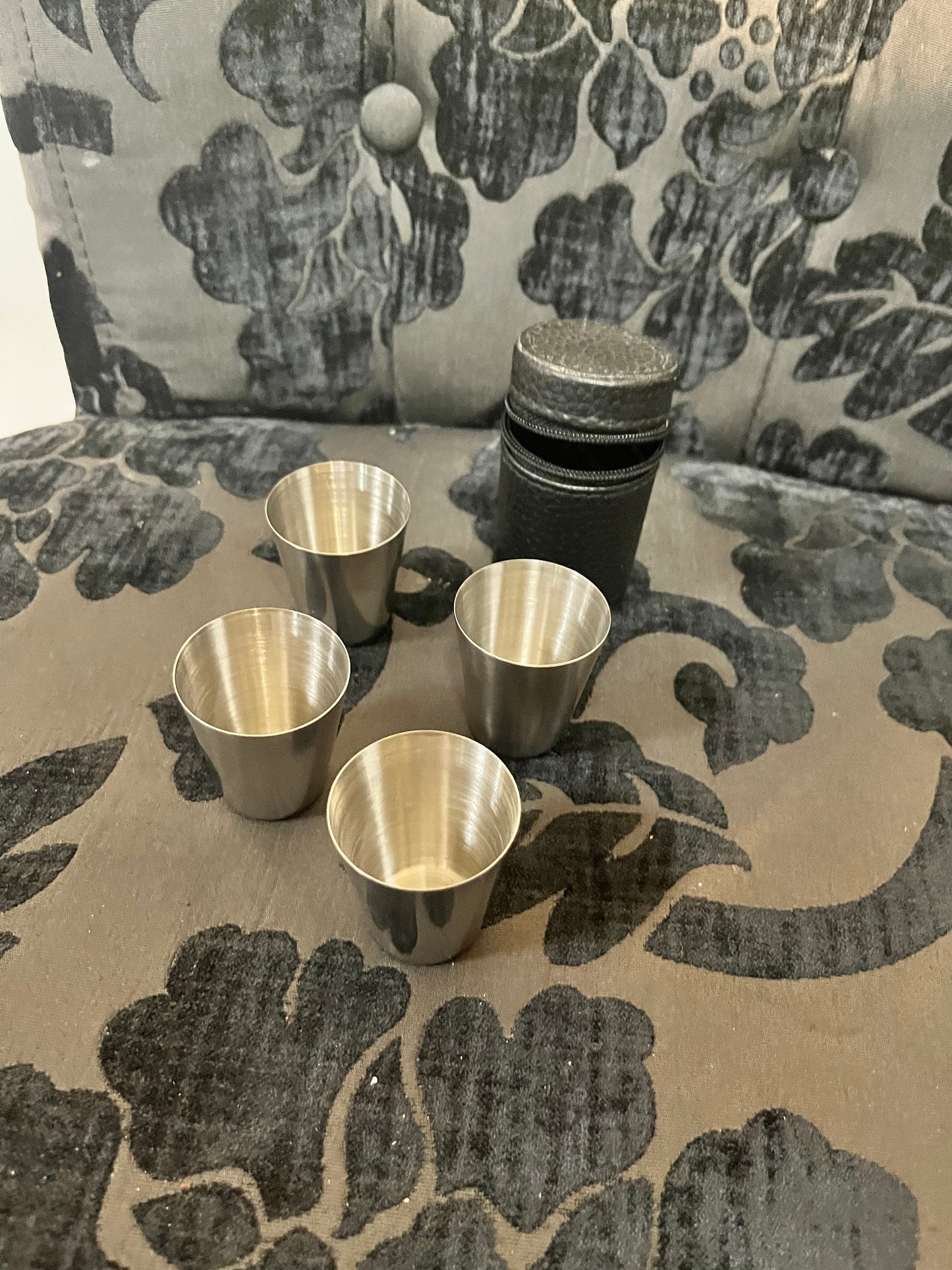 4 metal shot glasses in leather holder  cool  good for picnic or home bar