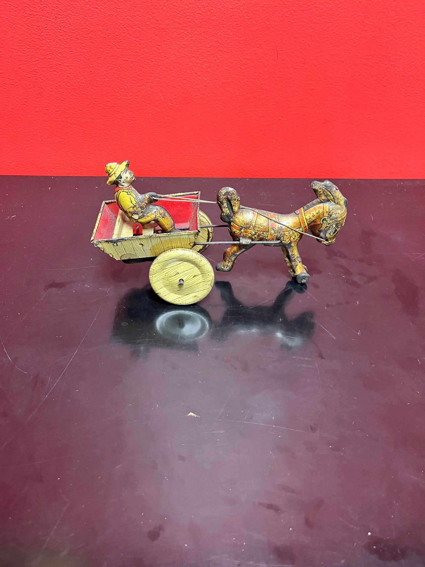 Magical antique tin man riding horse buggy  rare.  8 inches long  good antique  condition