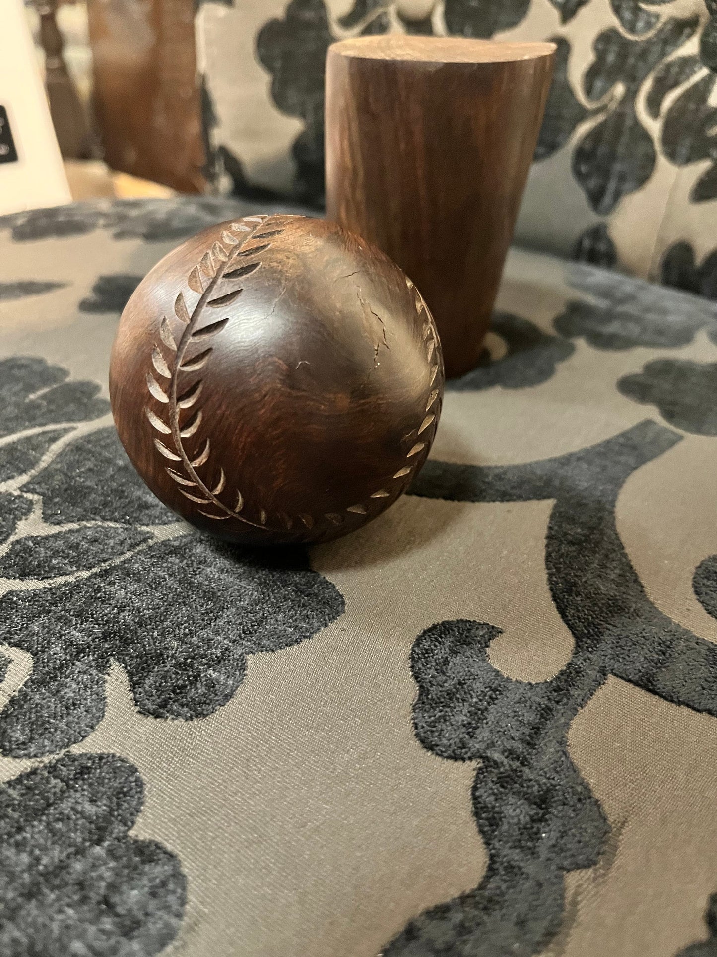 An Amazing vintage African carved wood baseball on stand   7 inches total tall