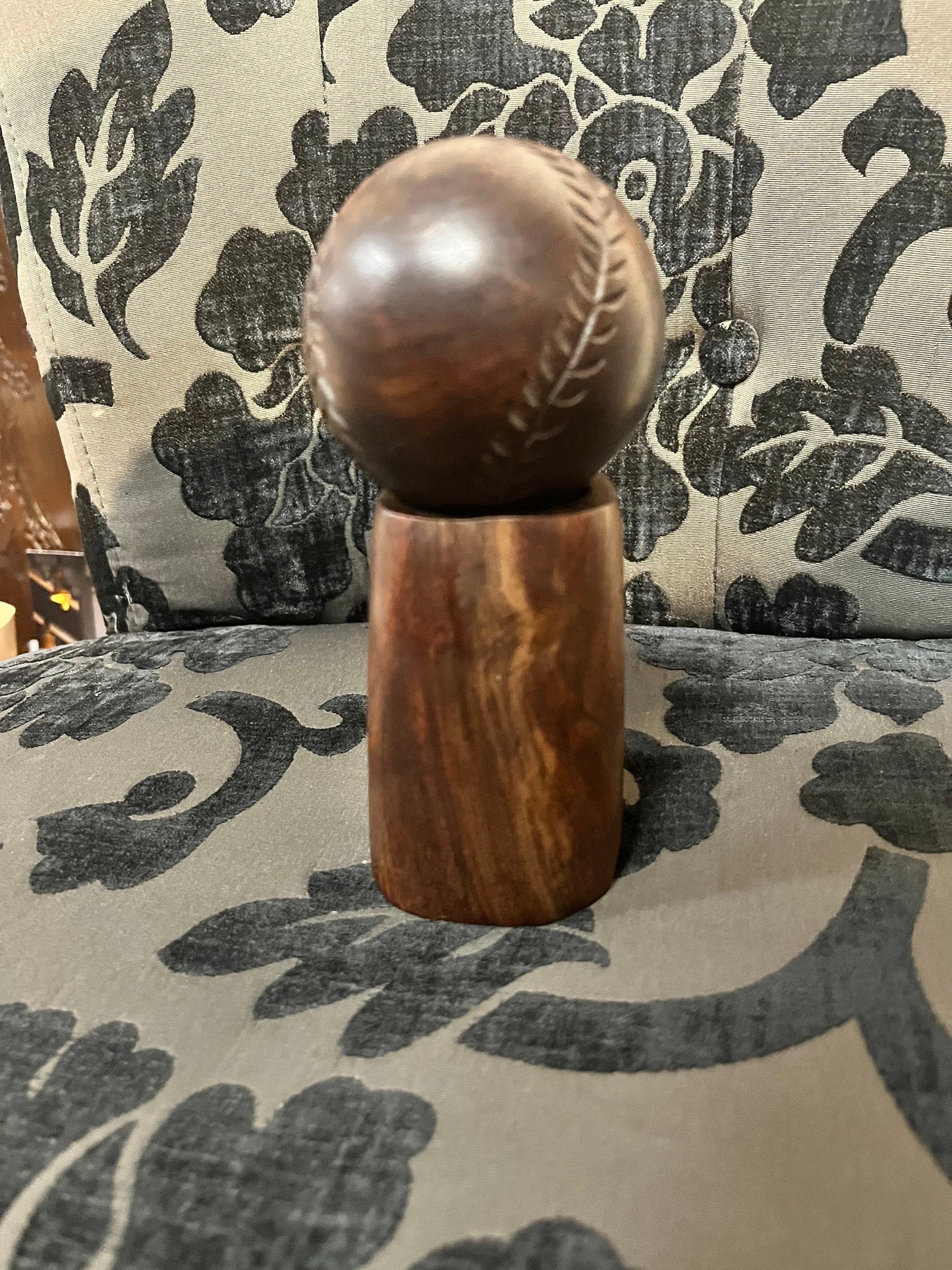 An Amazing vintage African carved wood baseball on stand   7 inches total tall