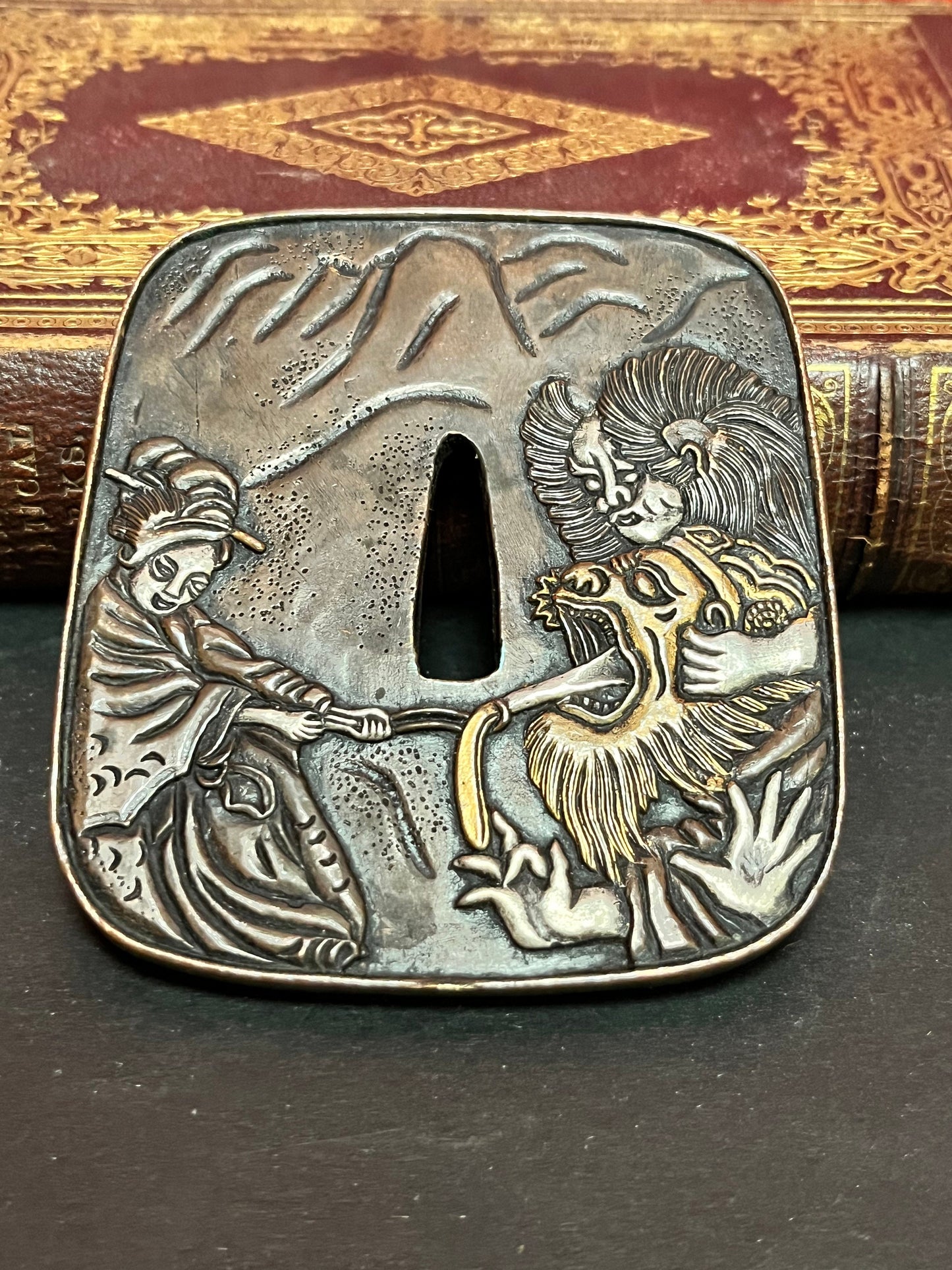 A  Stunning 4 inch, 19 century bronze Japanese  tsuba  geisha fighting a demon signed the best of the best