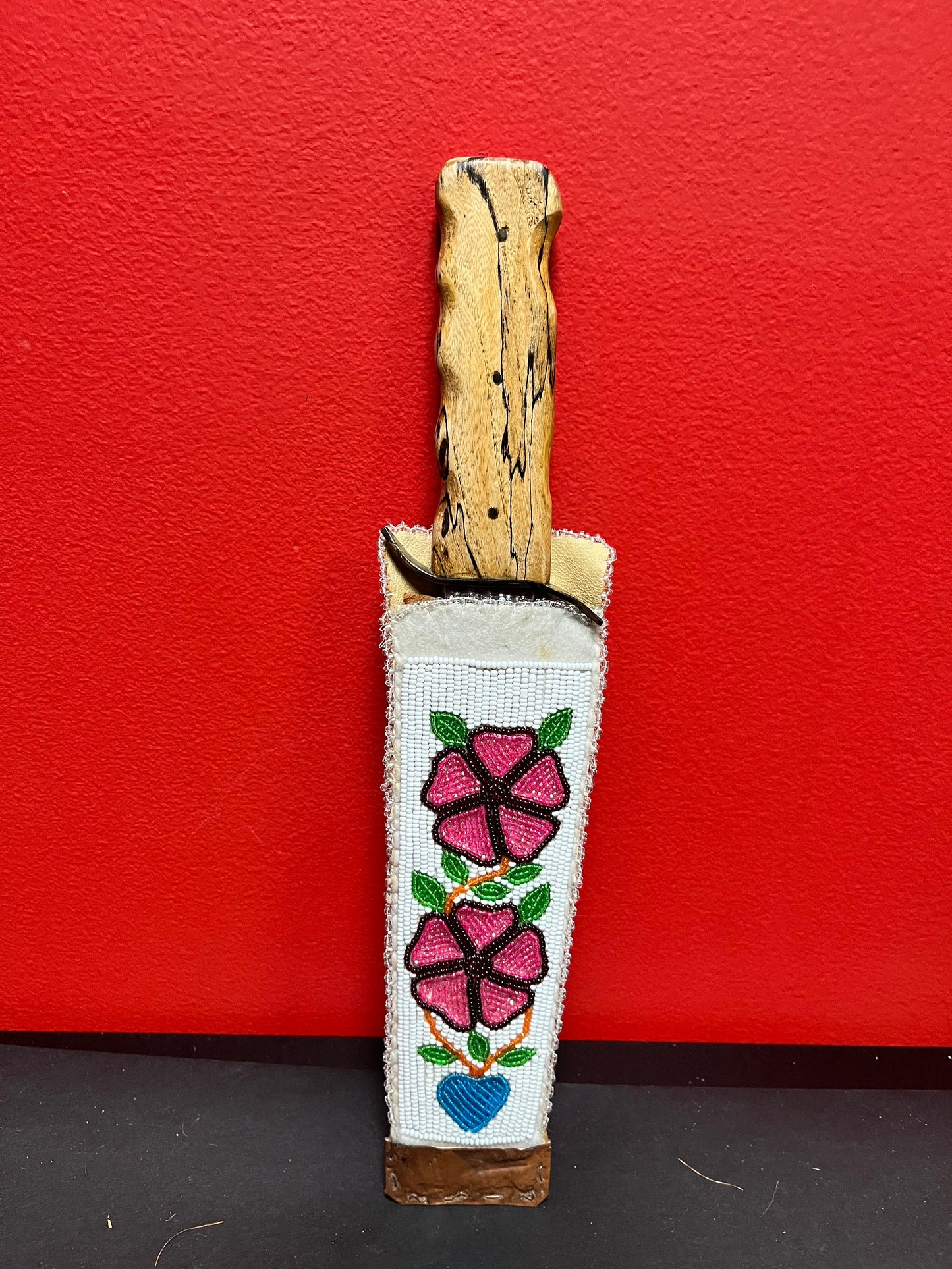 Stunning 14 inch long German knife with wood handle in indigenous west coast, heavily beaded, leather and copper sheaf