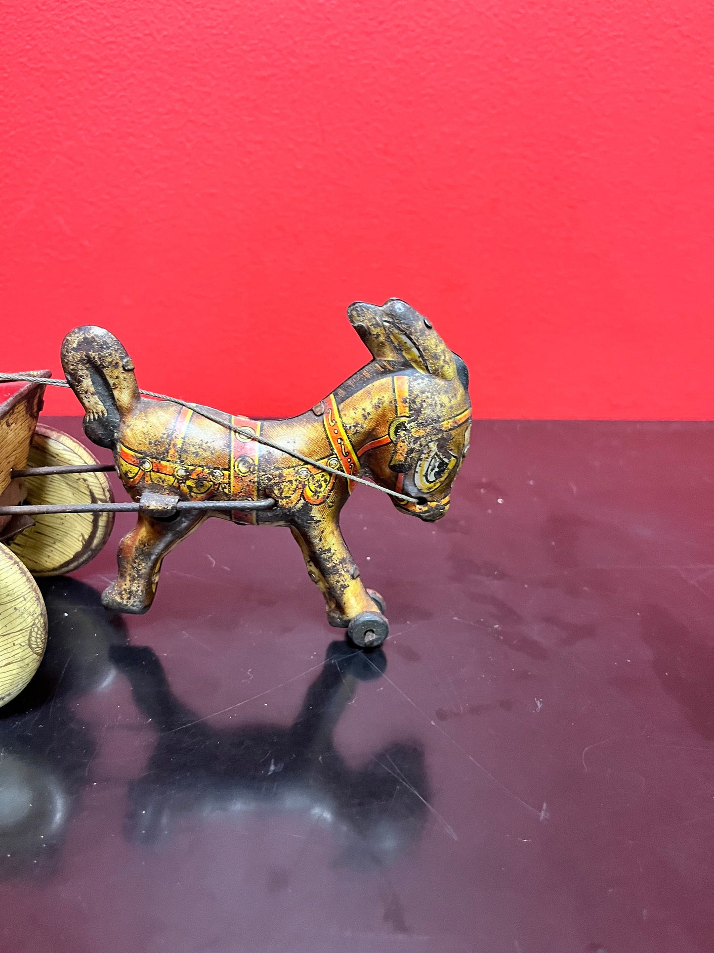 Magical antique tin man riding horse buggy  rare.  8 inches long  good antique  condition