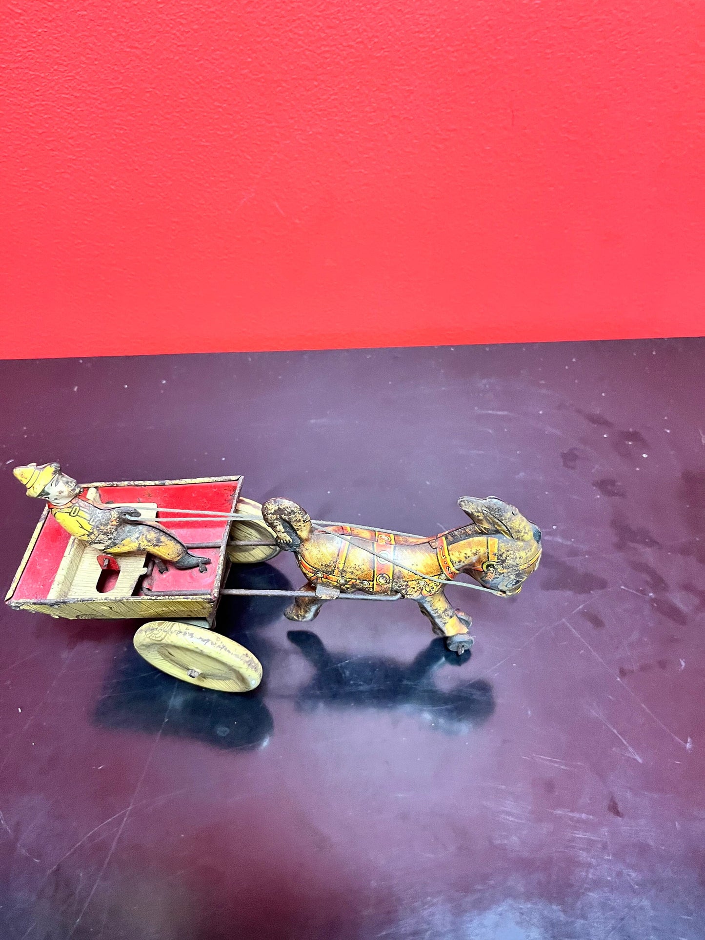 Magical antique tin man riding horse buggy  rare.  8 inches long  good antique  condition