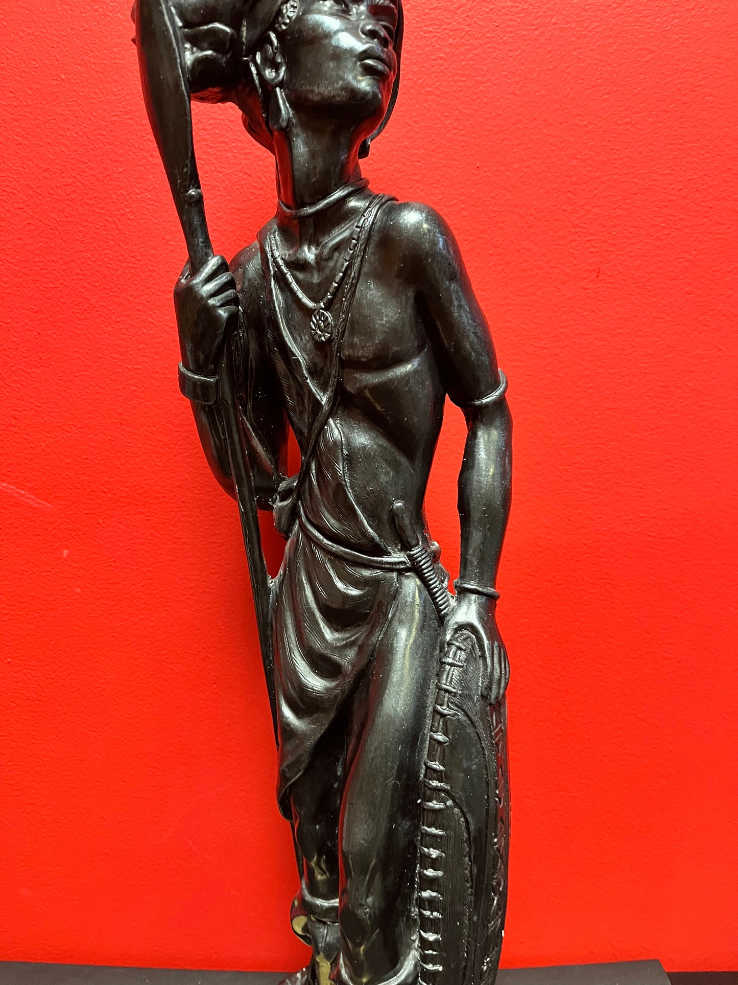 A Magnificent 25 x 7 wide vintage African spelter bronze statue of a warrior on brass base  unbelievable detail and patina.  wow