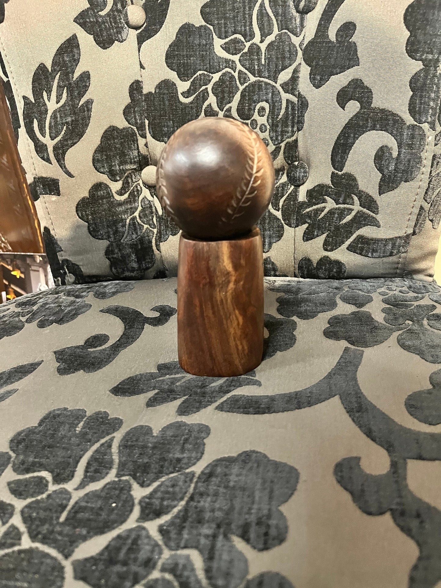 An Amazing vintage African carved wood baseball on stand   7 inches total tall