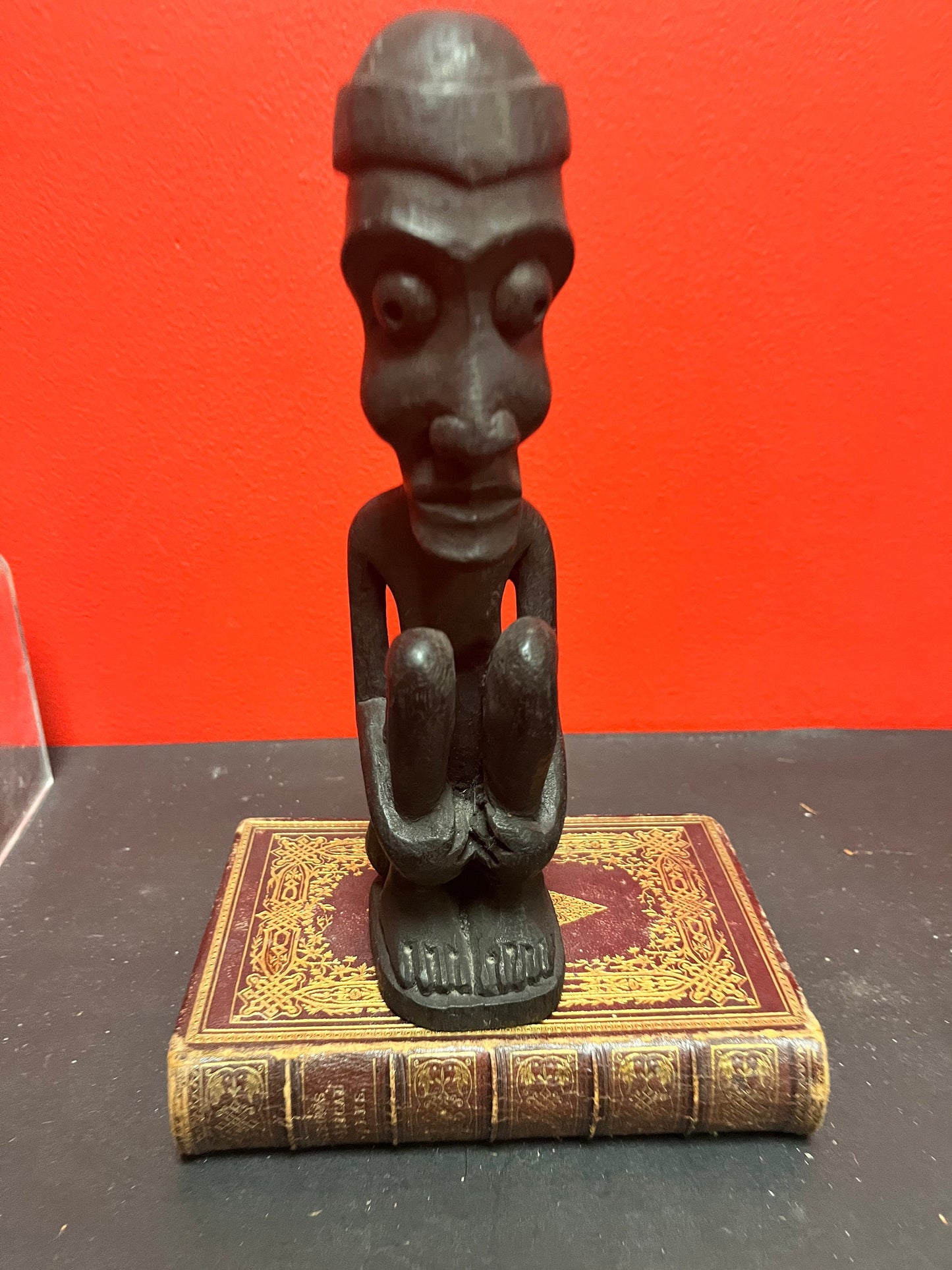 8.5 inch high western African seated vinatge wooden statue  great condition