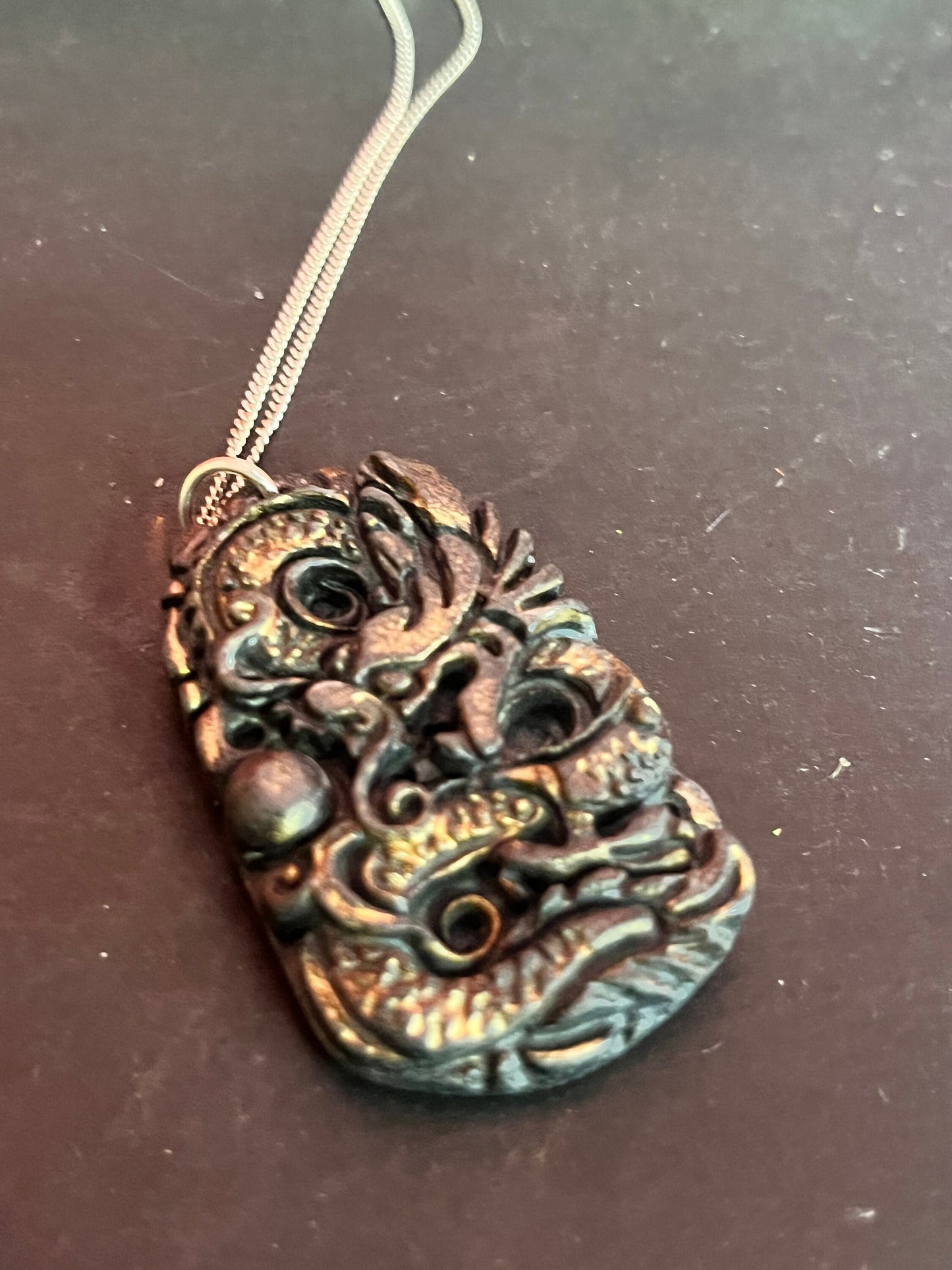 Two inch stone Chinese dragon pendant with silver necklace