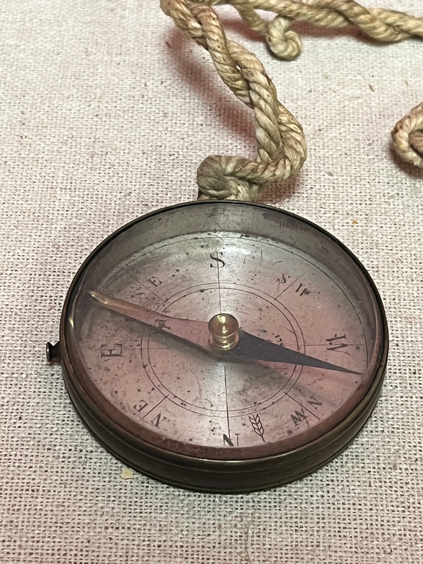 2 inch antique  brass compass   Seems to work, but sold  as is