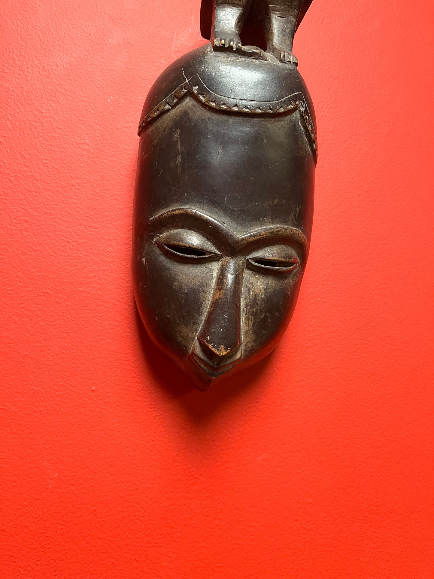 Studying antique ceremonial western African 11 inch tall bird mask   great patina and condition