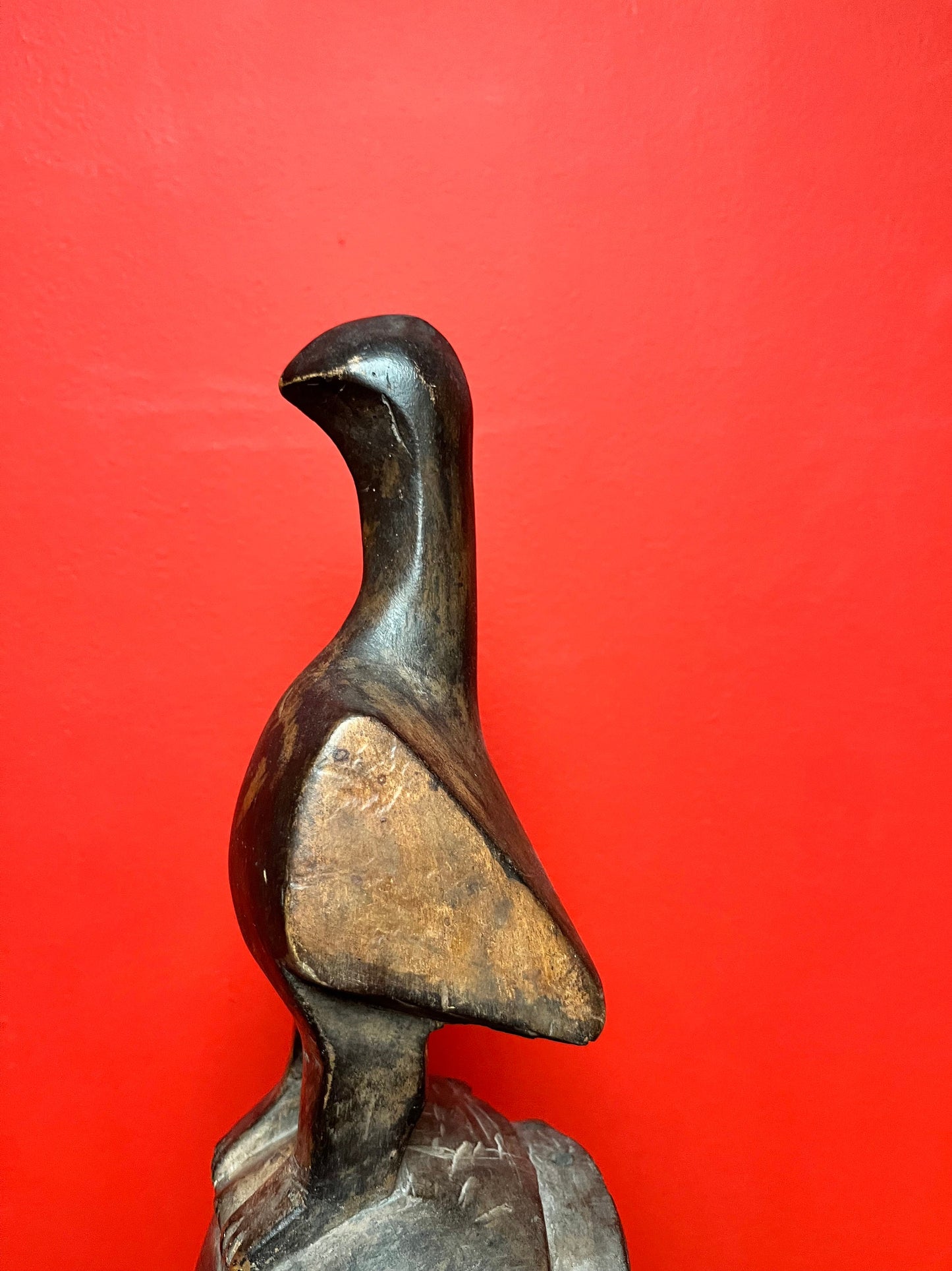 Studying antique ceremonial western African 11 inch tall bird mask   great patina and condition