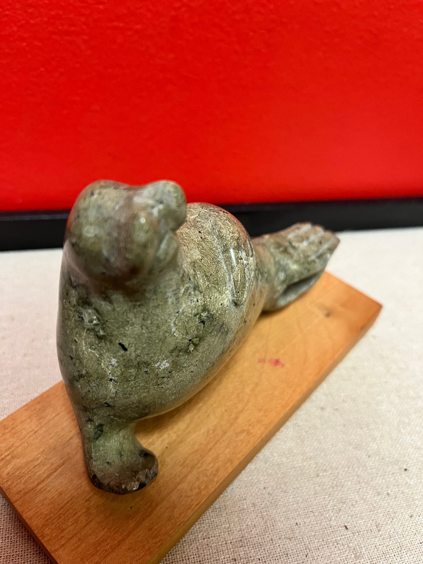 Lovely indigenous Inuit soapstone 7 x 4 high walrus on stand  cracked tail, so see photos and priced low accordingly