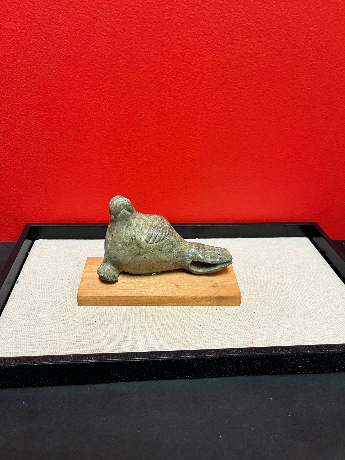 Lovely indigenous Inuit soapstone 7 x 4 high walrus on stand  cracked tail, so see photos and priced low accordingly