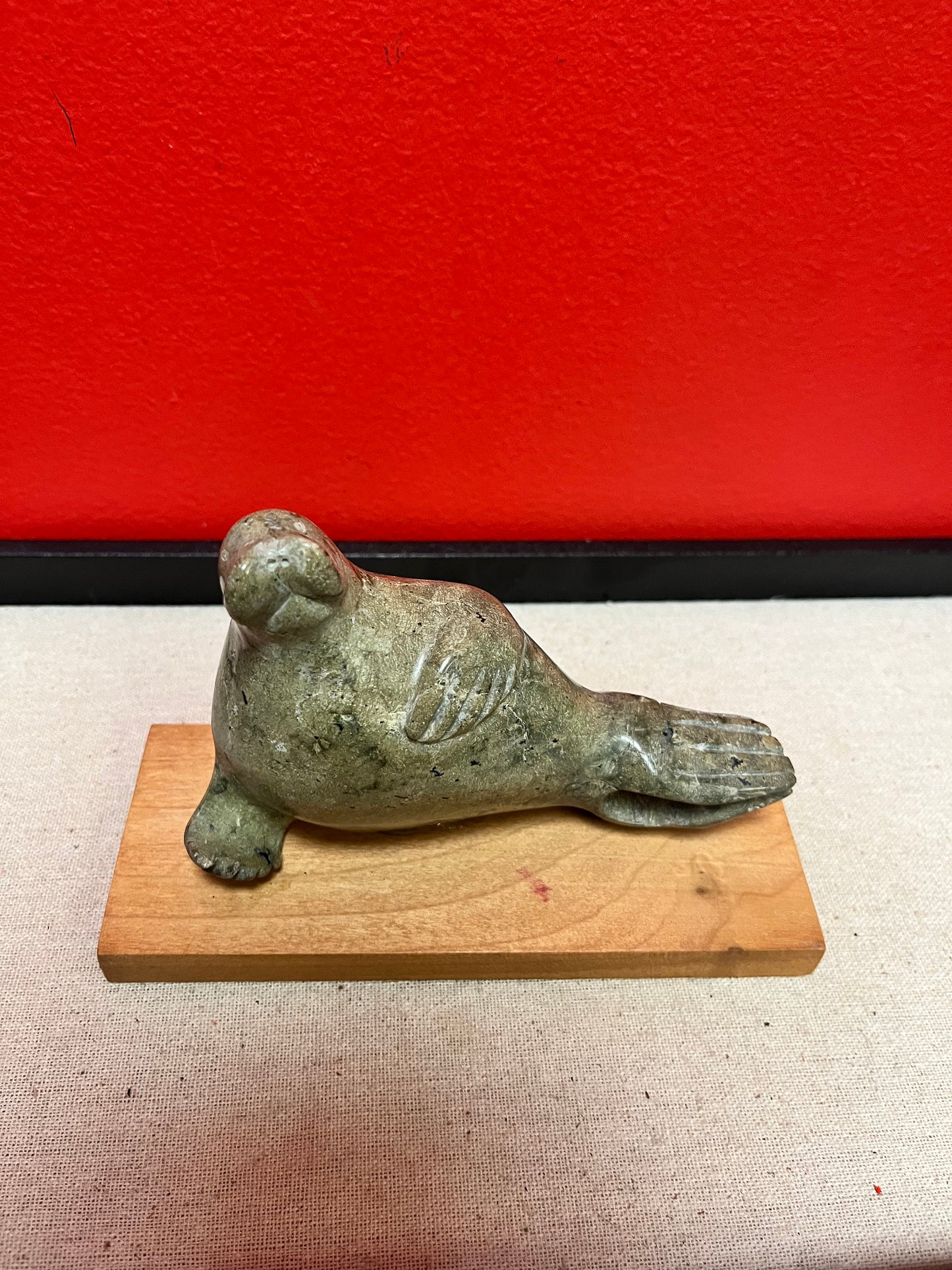 Lovely indigenous Inuit soapstone 7 x 4 high walrus on stand  cracked tail, so see photos and priced low accordingly