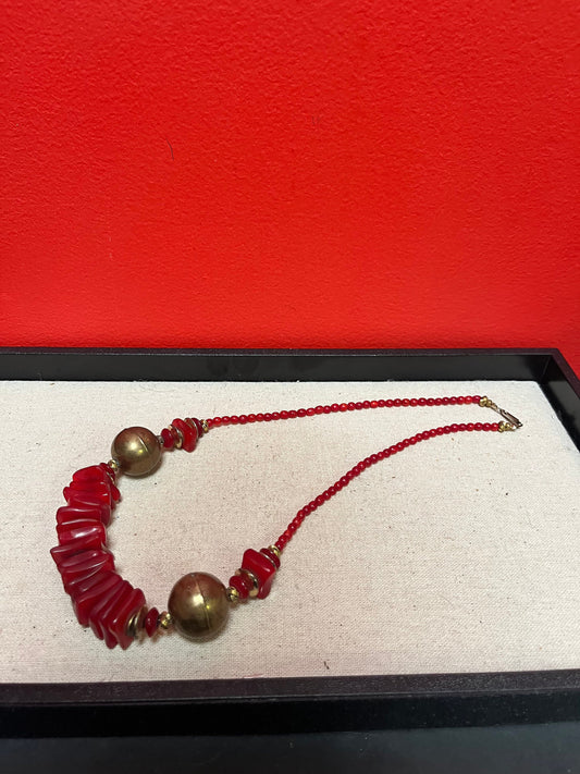 Approximately 22 inch long lucite  and brass necklace  great colour and look