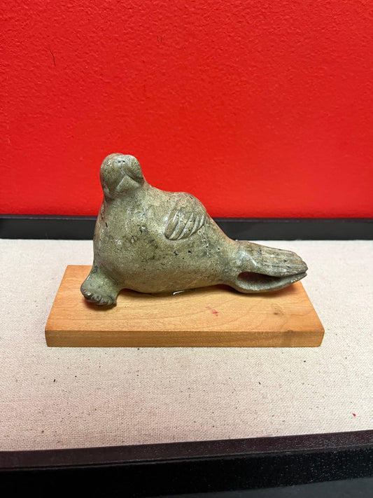 Lovely indigenous Inuit soapstone 7 x 4 high walrus on stand  cracked tail, so see photos and priced low accordingly