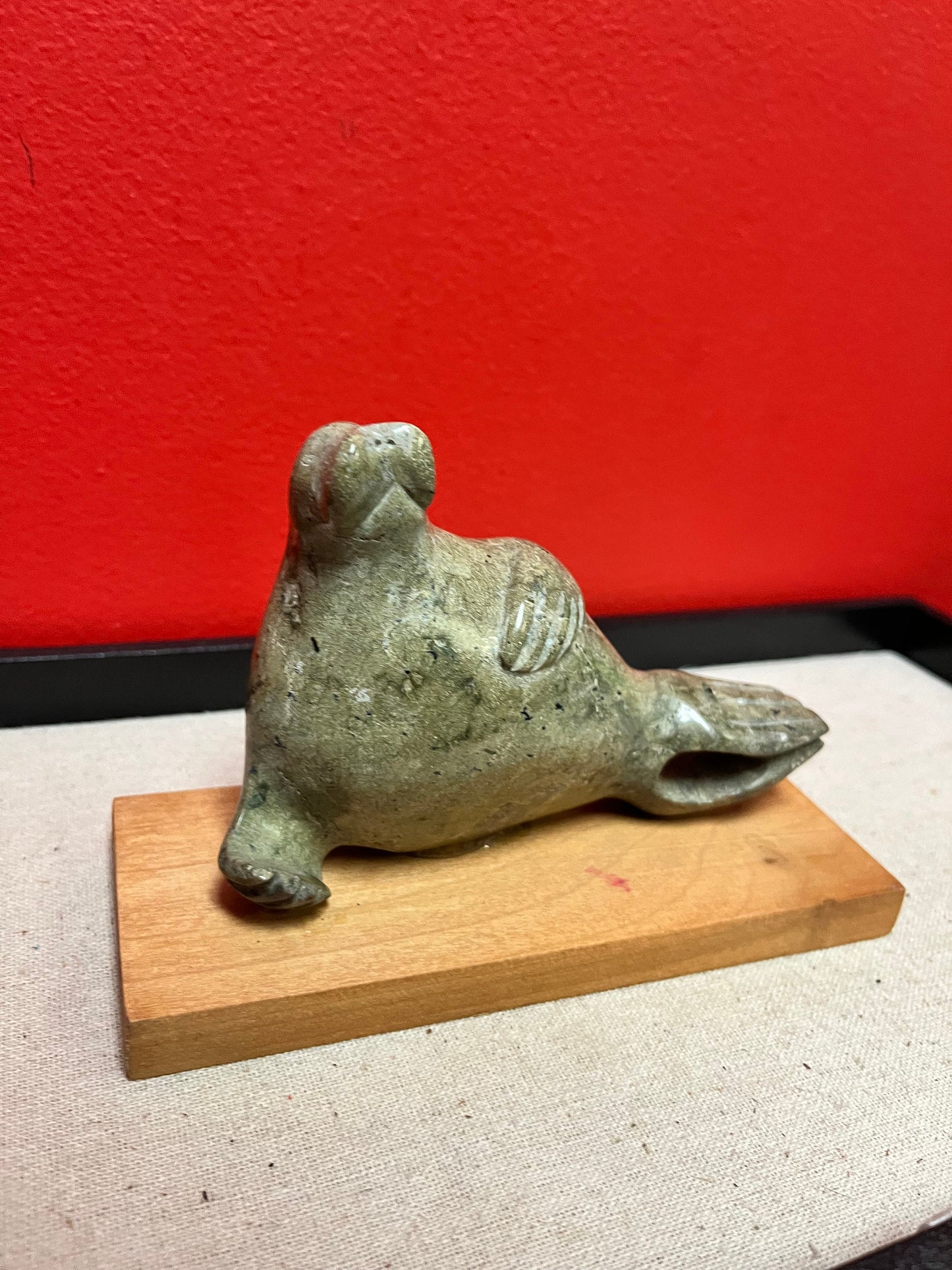 Lovely indigenous Inuit soapstone 7 x 4 high walrus on stand  cracked tail, so see photos and priced low accordingly