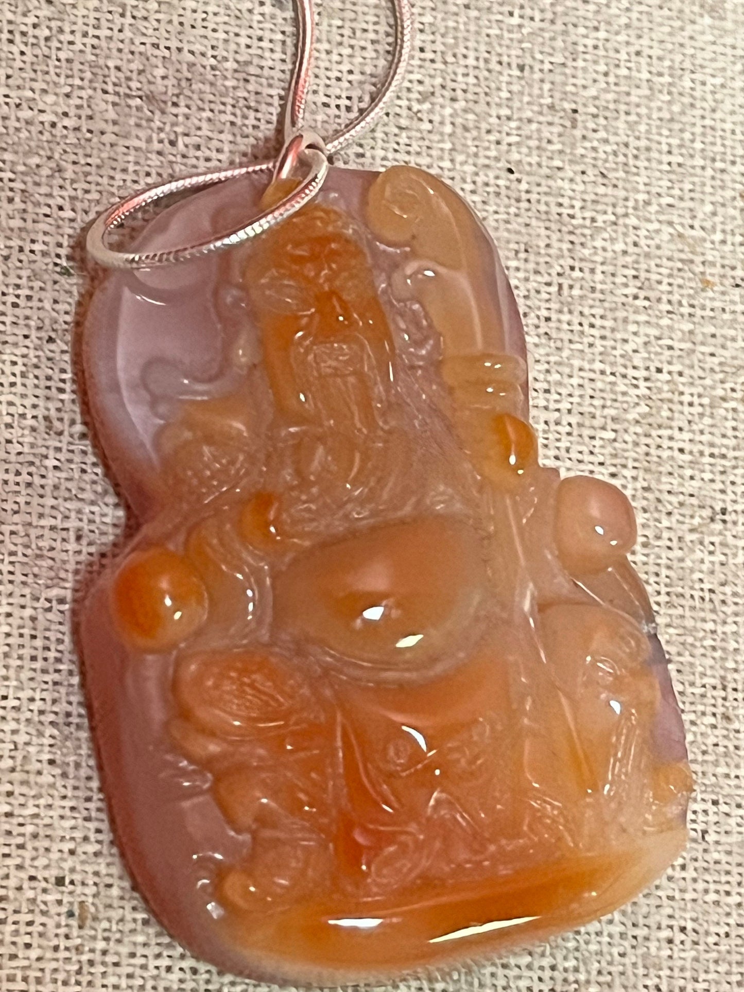 Fabulous 2 inch long chameleon agate pendant depicting Confucius with a free silver chain