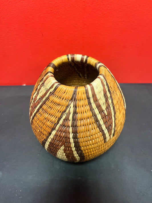 Fabulous 7 1/2 inch high vintage western African handmade basket with fire symbolism decoration