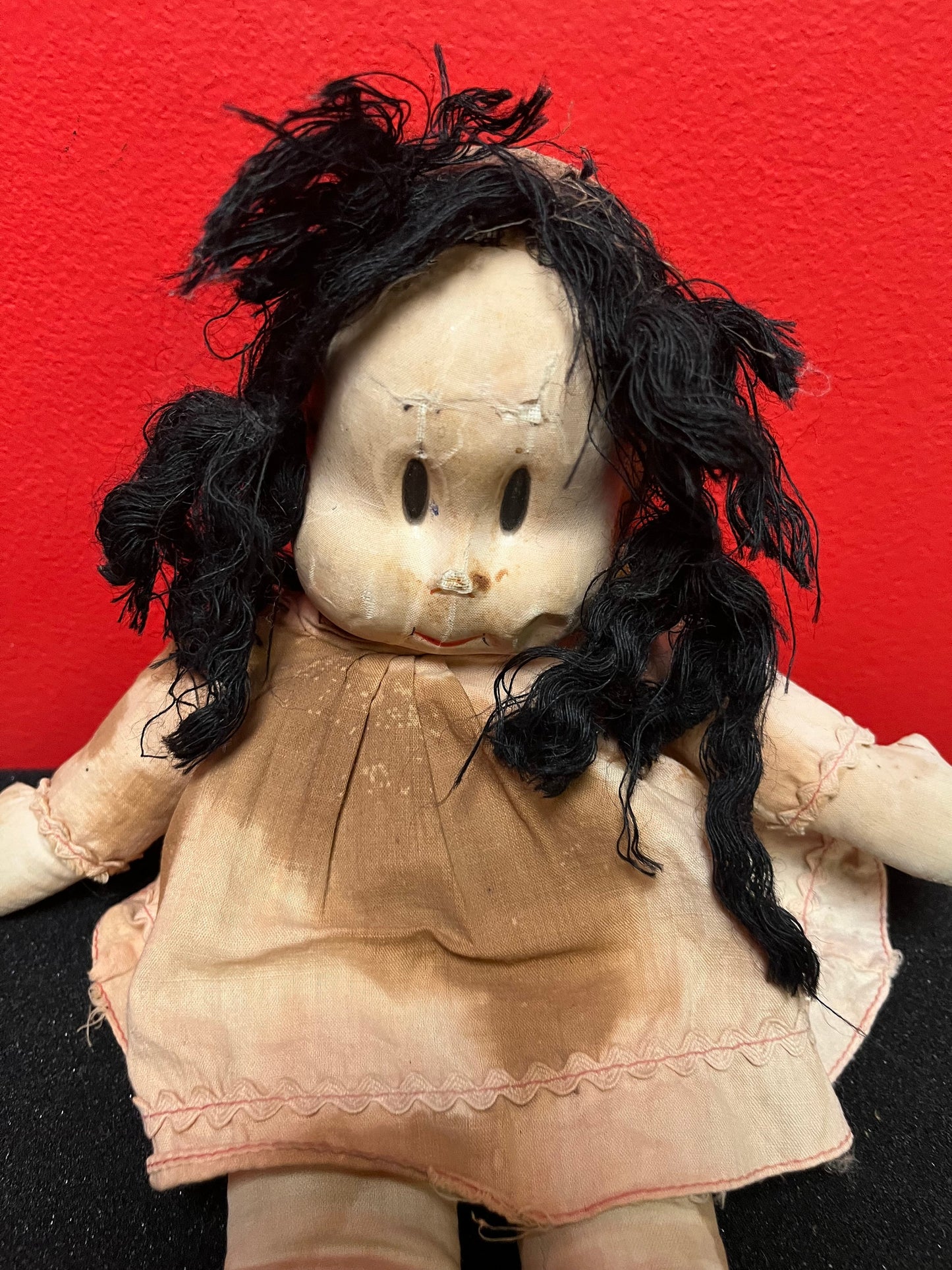 An  Antique 15 inch high Lulu doll in bad condition