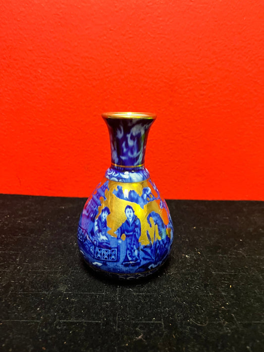 Lovely 4 inch Asian blue and gold vase   small and beautiful and in perfect  condition