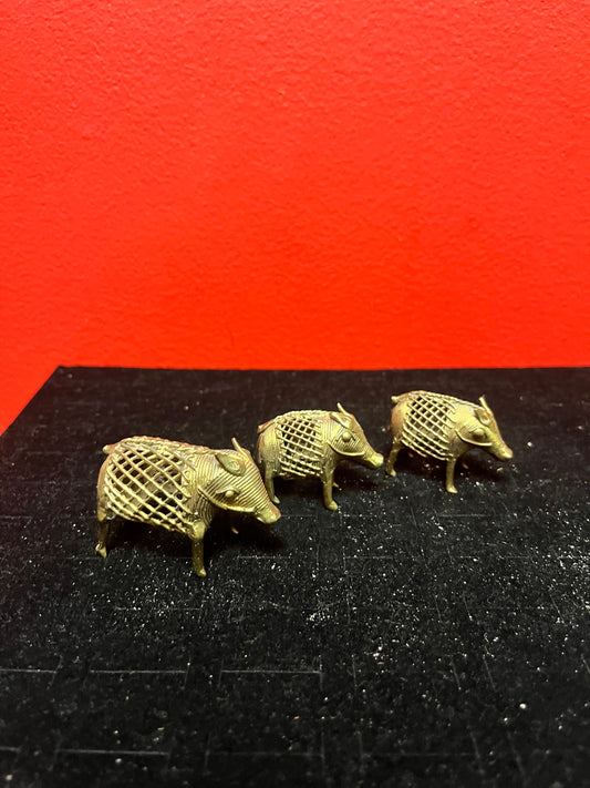 Lovely set of three African Benin brass boars  older  1.5 to 2 inches long each