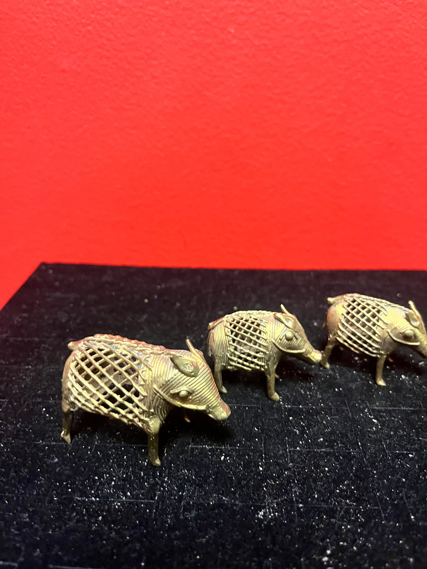 Lovely set of three African Benin brass boars  older  1.5 to 2 inches long each