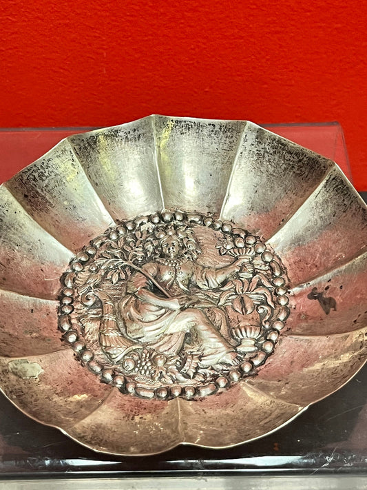 A  Persian silver bowl   7 inches and untested  great imagery and needs a polish