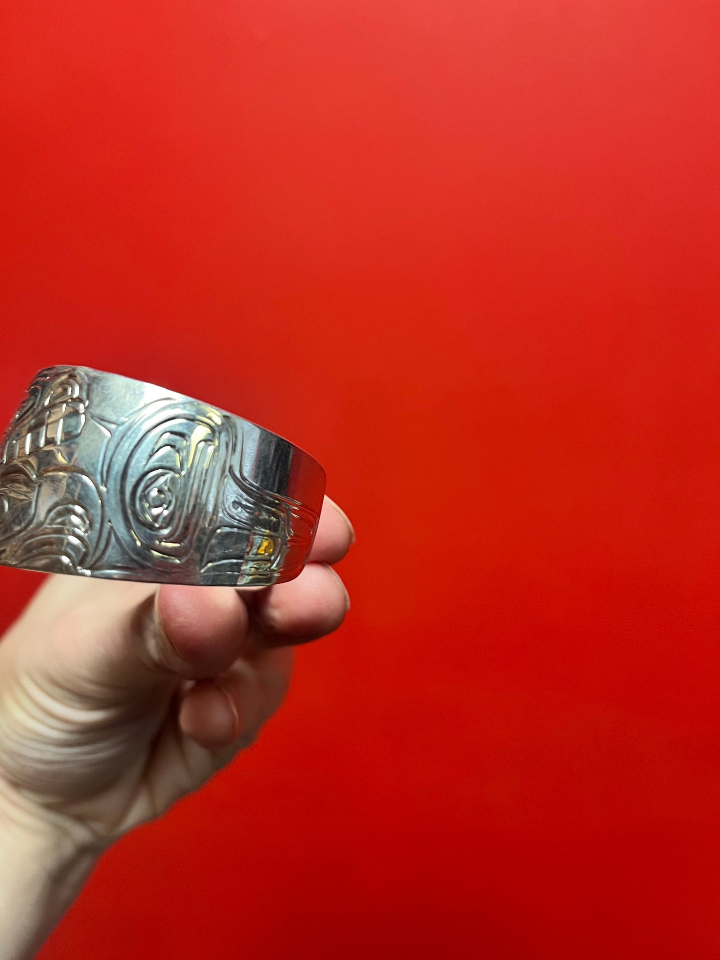 A Stunning signed 2 1/2 inch by one and a half inch high high-quality detailed indigenous first nations northwest coast heavy sterling cuff