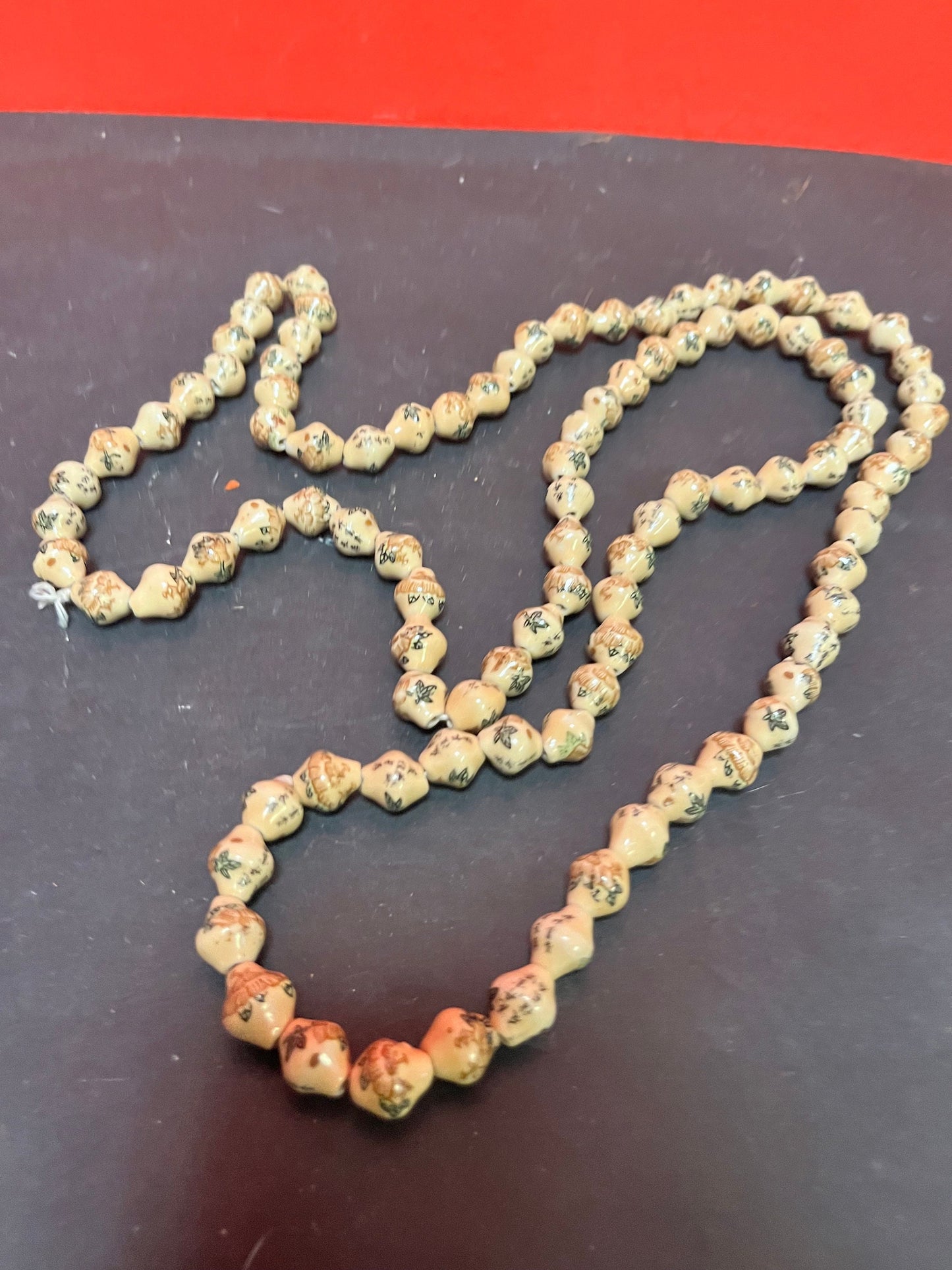 A  Stunning antique Chinese individually, signed pottery bead necklace  approximately 52 inches long - amazing