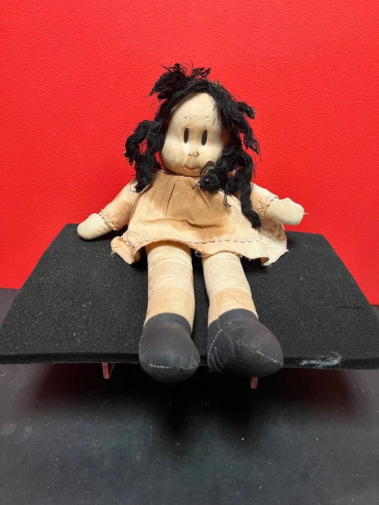 An  Antique 15 inch high Lulu doll in bad condition