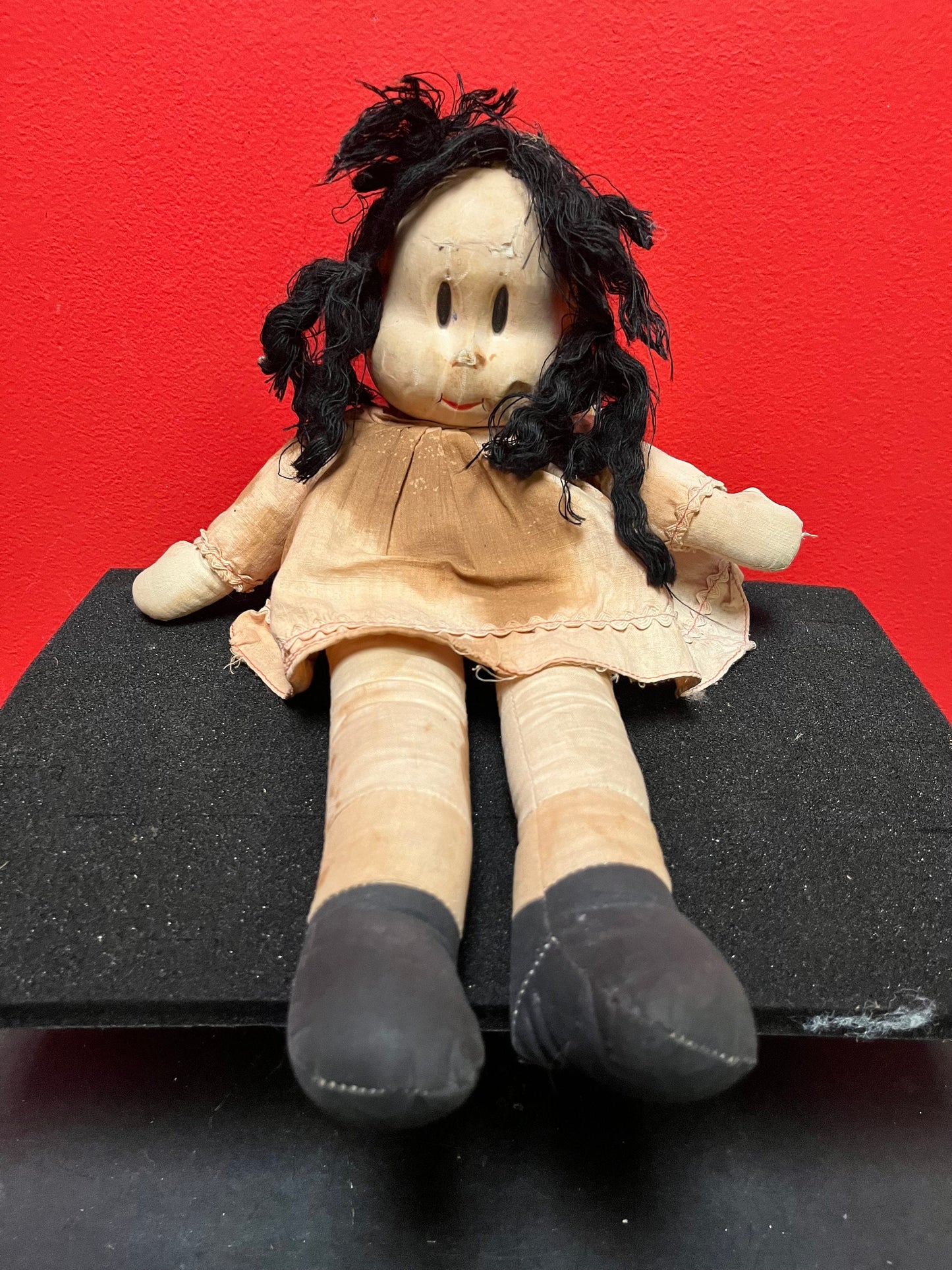 An  Antique 15 inch high Lulu doll in bad condition